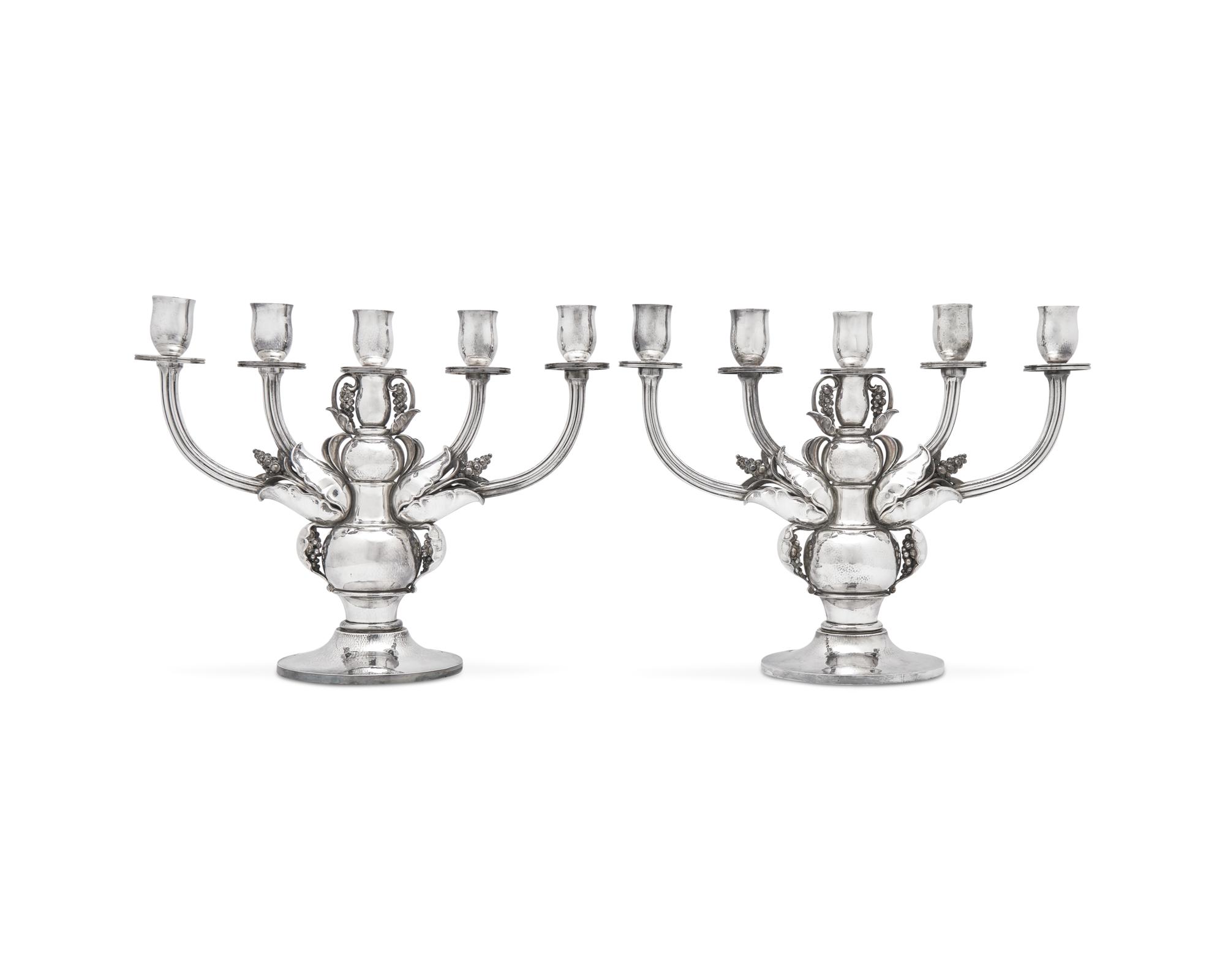 A Pair of Georg Jensen Designed Silver Five-Light Candelabra