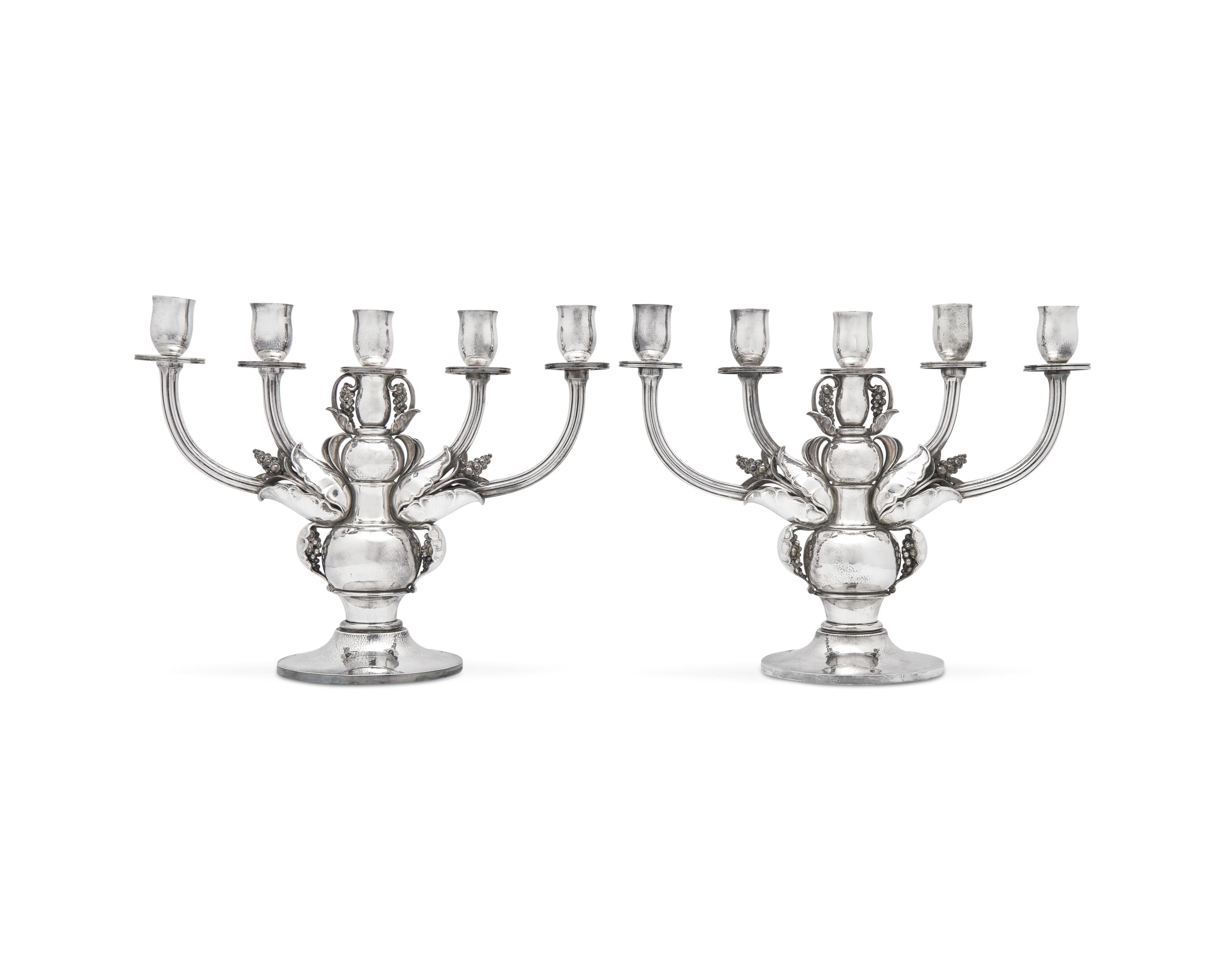 A Pair of Georg Jensen Designed Silver Five-Light Candelabra