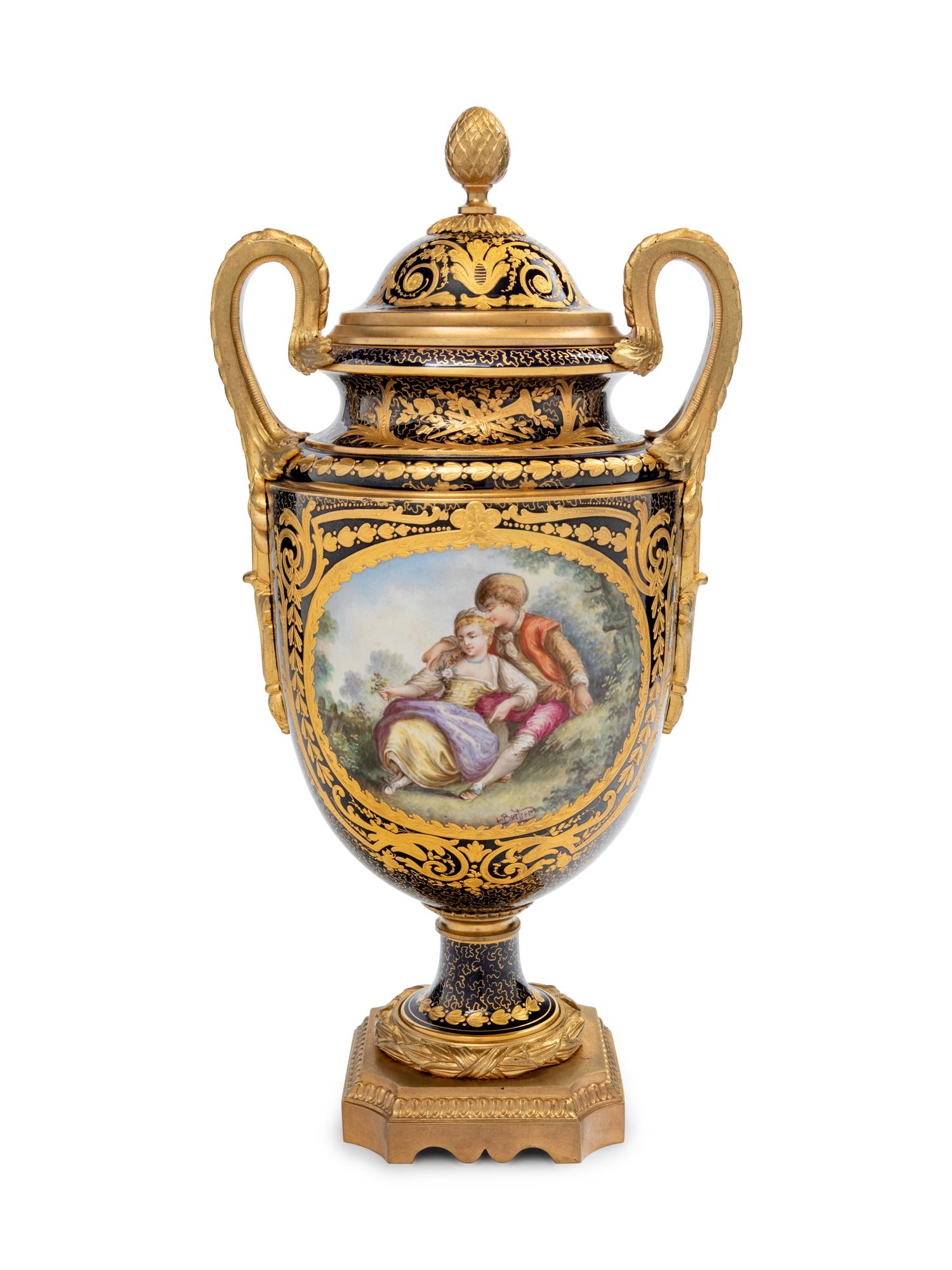 A Sèvres Style Gilt Bronze Mounted Painted and Parcel Gilt Porcelain Covered Urn