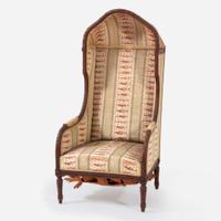 A Louis XVI Style Carved Walnut Hooded Butler's Chair late 19th century