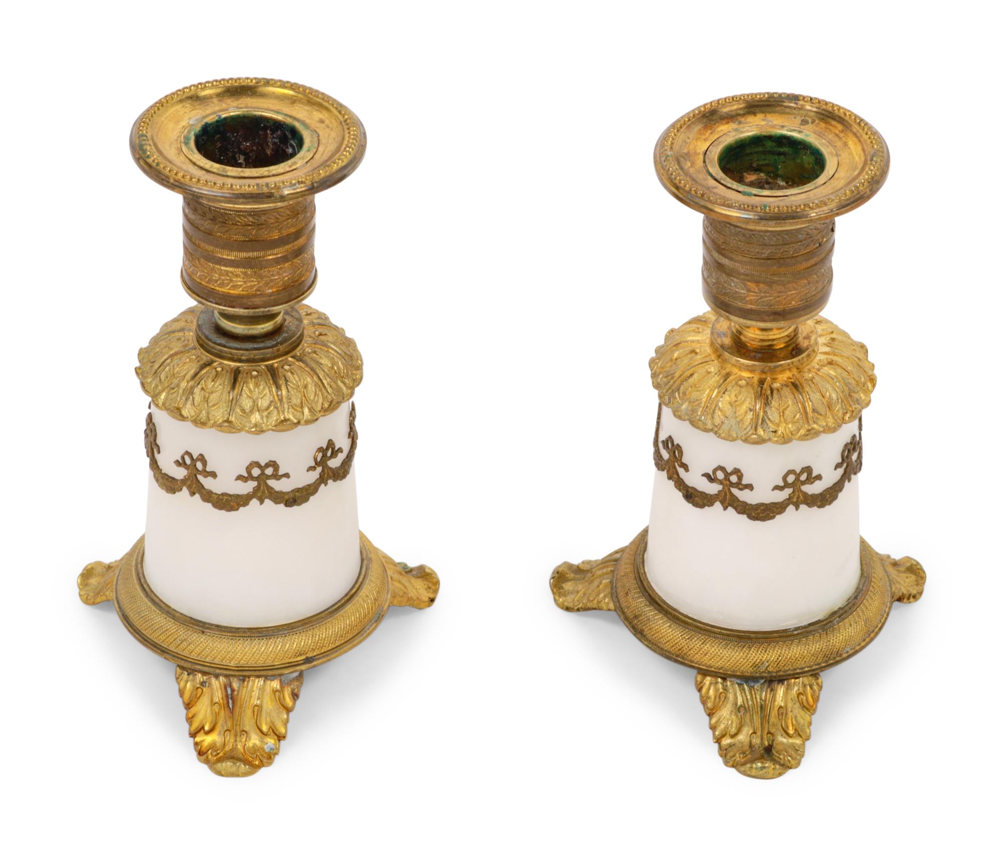 A Pair of Empire Style Gilt Bronze Mounted Marble Candlesticks