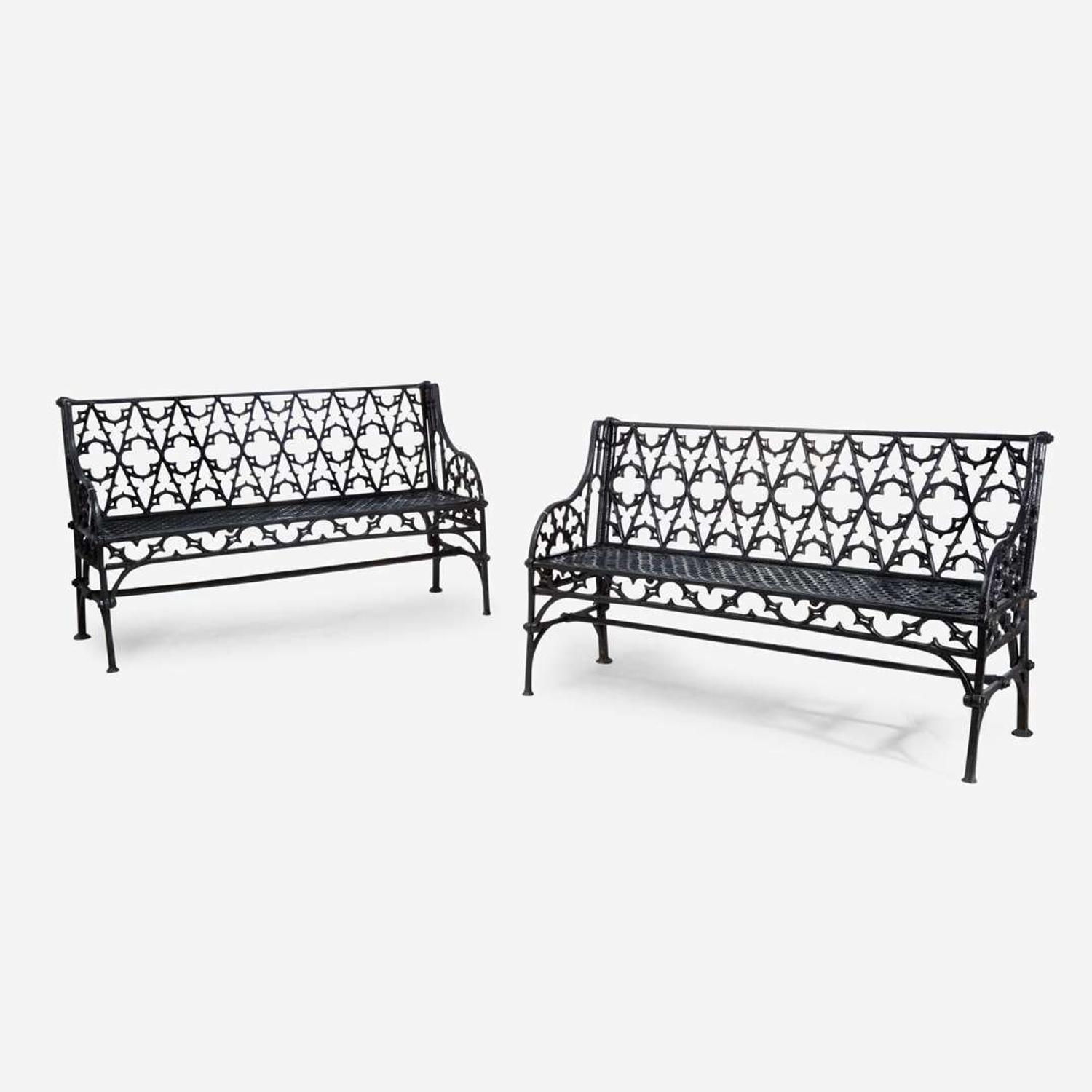 A pair of Gothic Revival black-painted cast iron garden benches 20th century