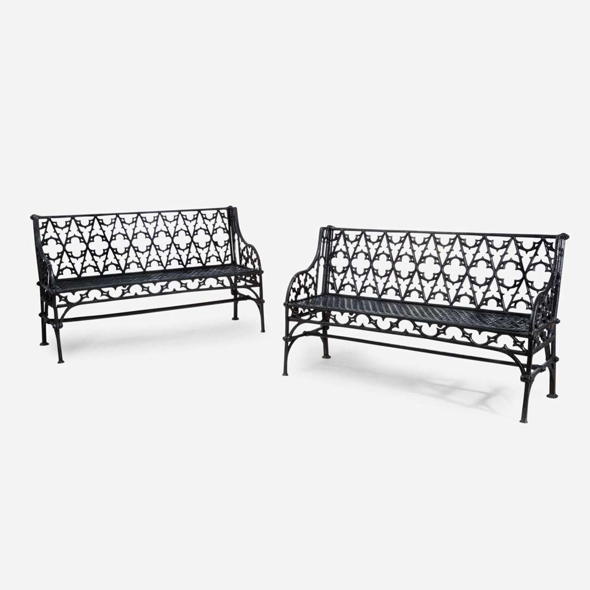 A pair of Gothic Revival black-painted cast iron garden benches 20th century