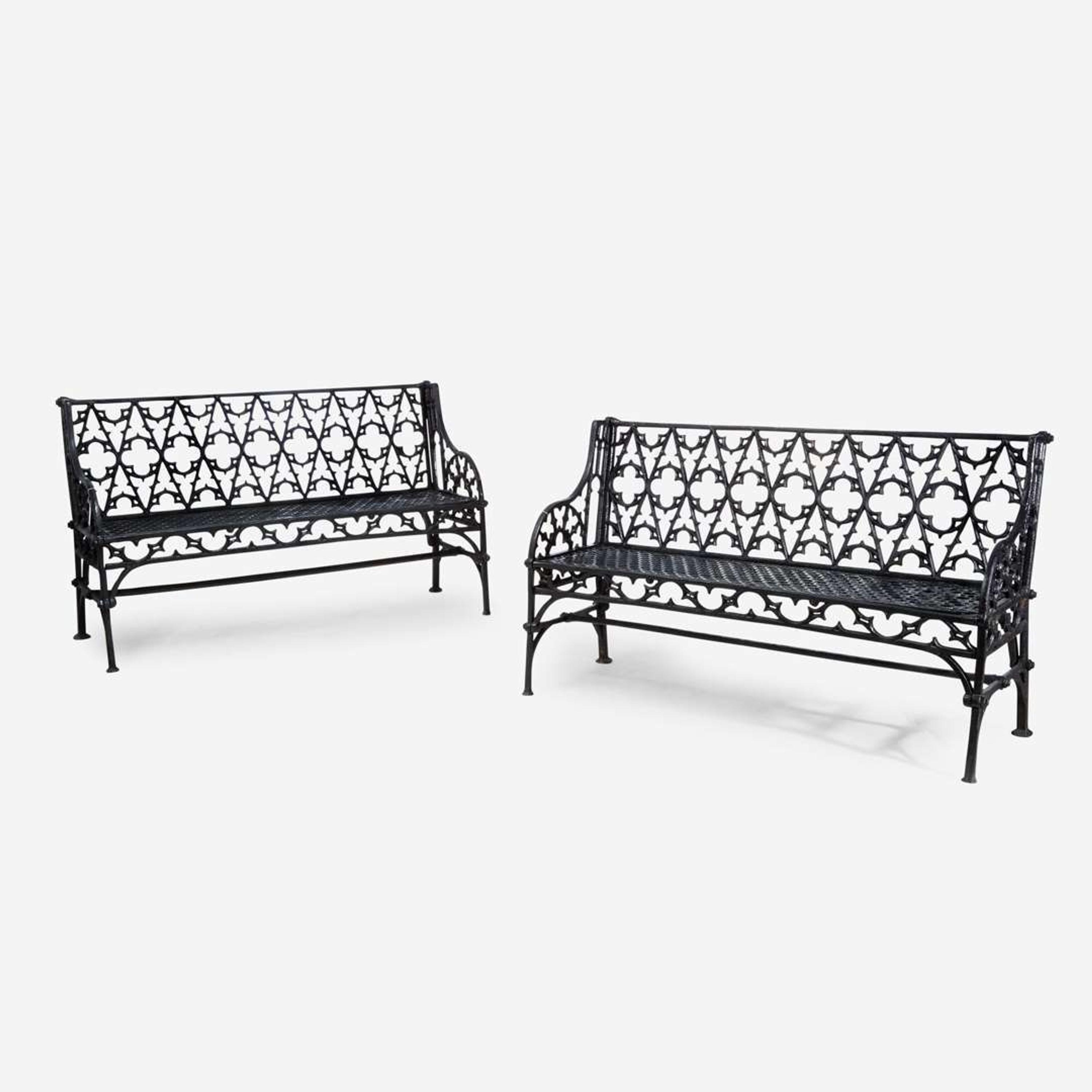 A pair of Gothic Revival black-painted cast iron garden benches 20th century