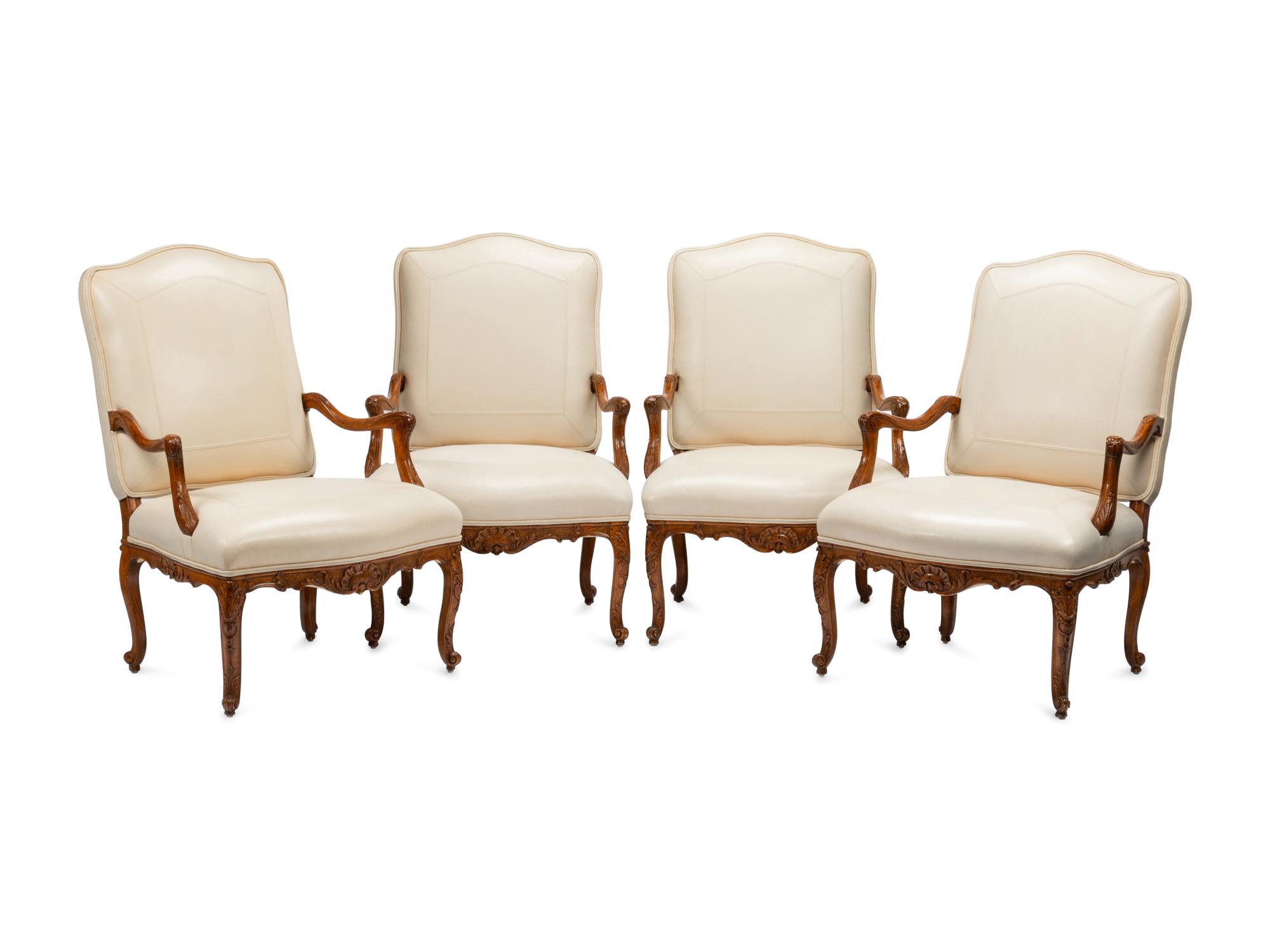 A Set of Four Régence Style Leather-Upholstered Armchairs