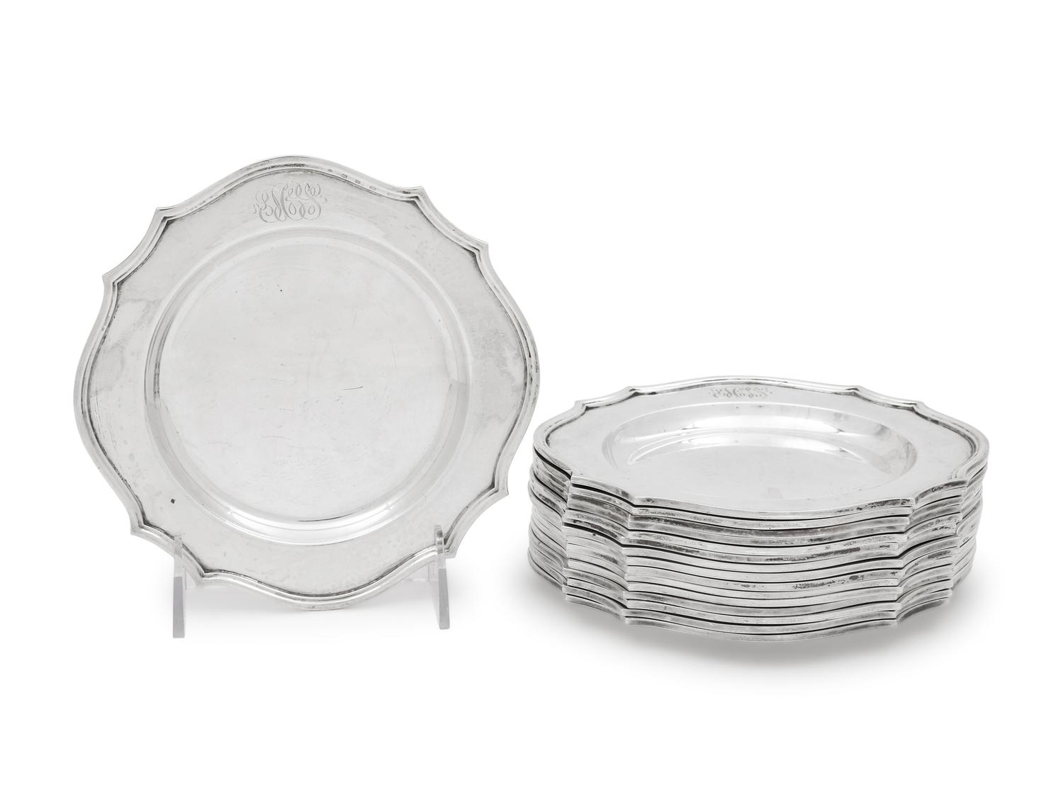 A Set of Sixteen American Silver Bread Plates