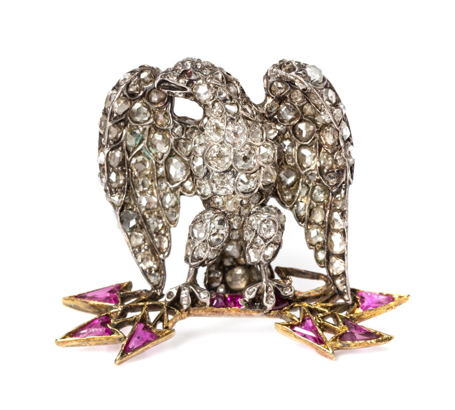 A Silver, Gold, Diamond and Ruby Eagle Brooch, 5.30 dwts.