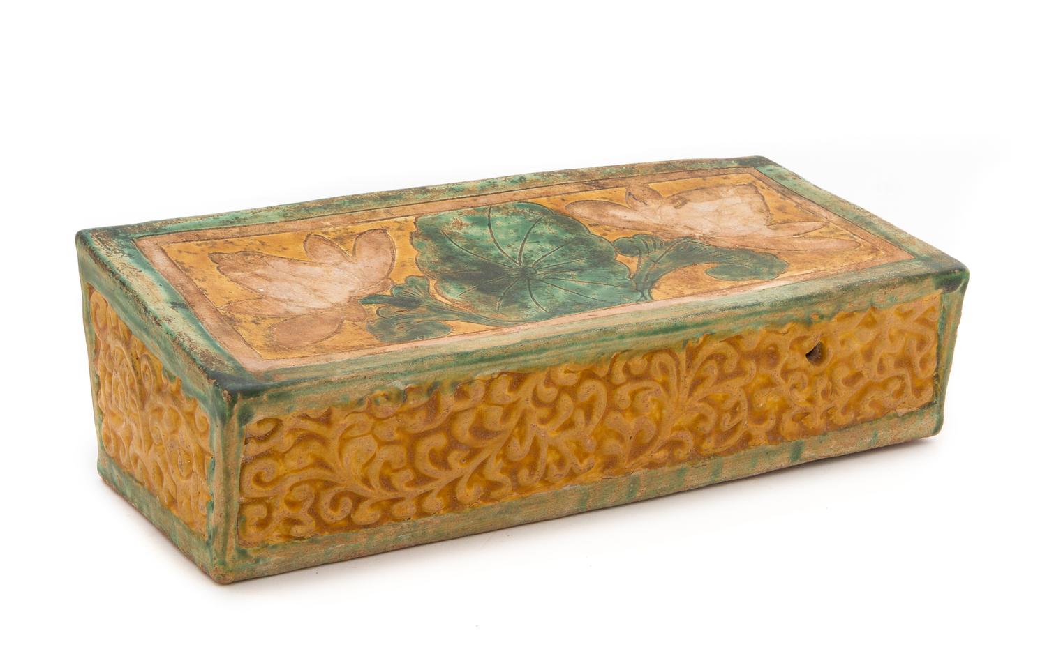 A Sancai Glazed Pottery Pillow Height 3 3/4 x width 13 x depth 5 5/8 inches.