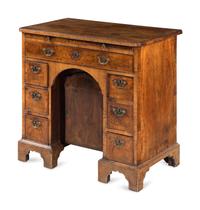 A George I Walnut Kneehole Desk