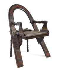 After Vasili Petrovich Shutov, RUSSIA, a Trompe L'Oeil armchair having an arched back with inscriptions, axe arm supports and splayed l