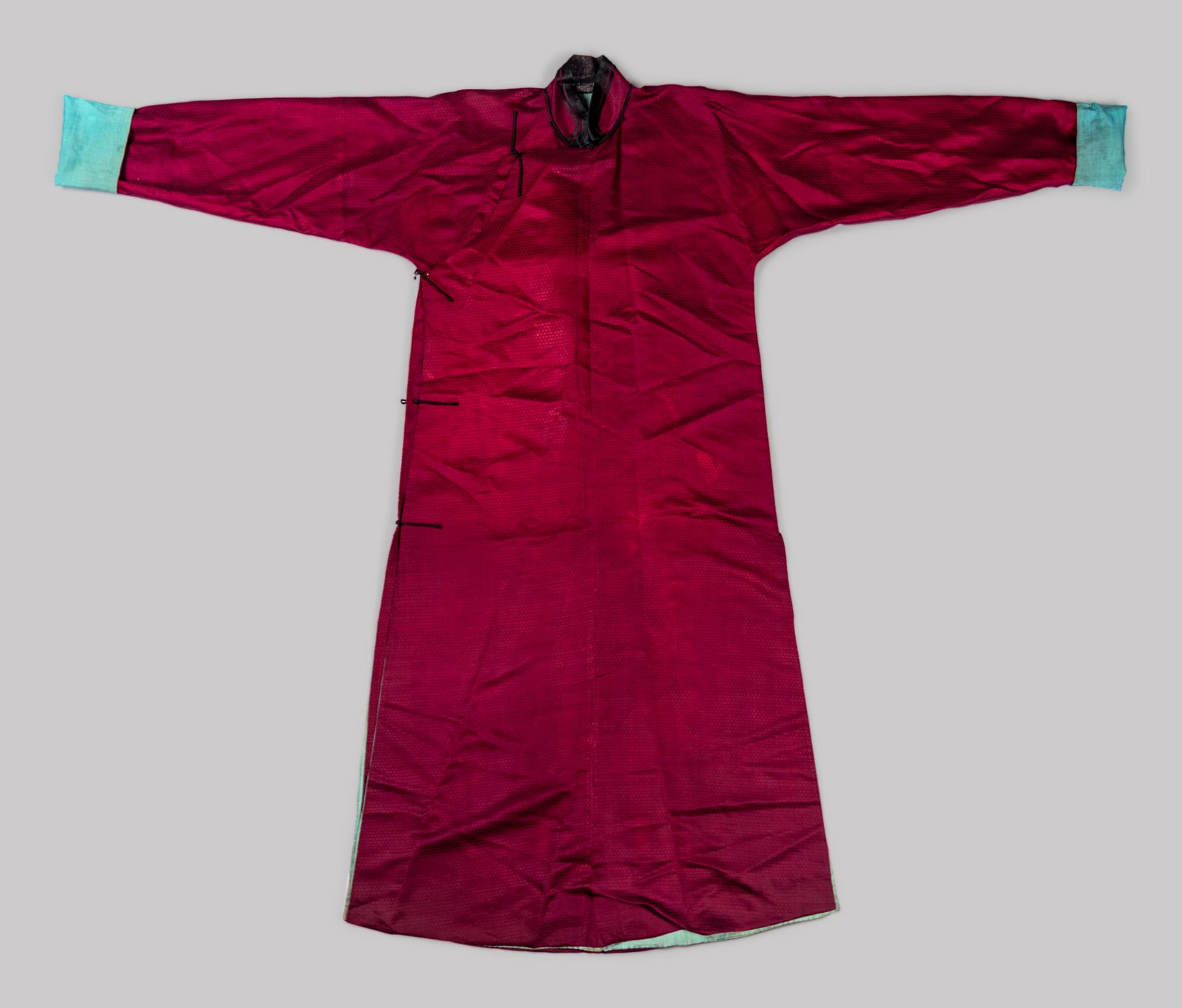 A Chinese Maroon Ground Woven Silk Robe