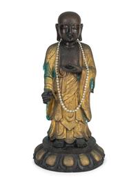 A Chinese Parcel-Gilt and Patinated Bronze Figure — 20TH CENTURY