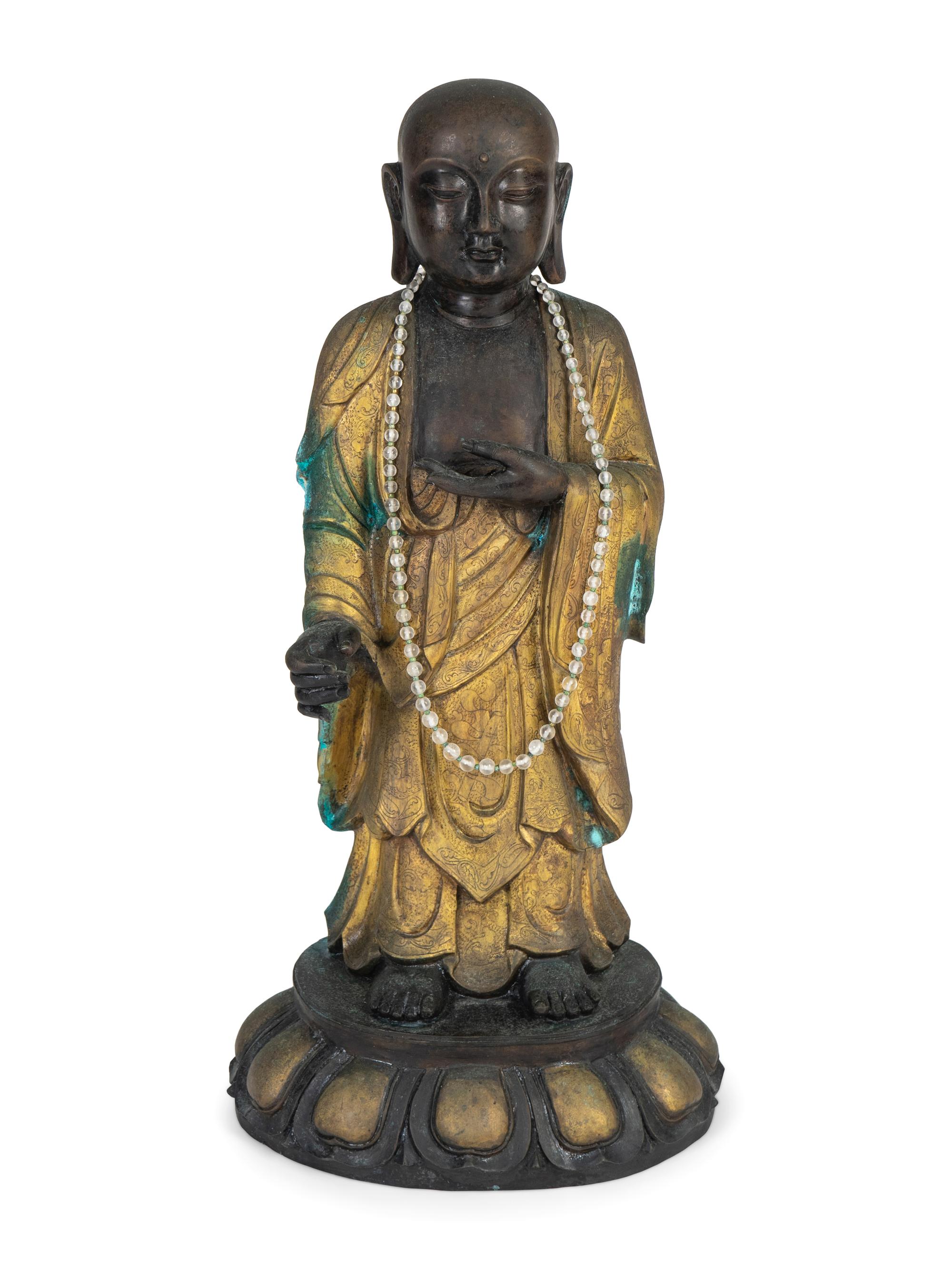 A Chinese Parcel-Gilt and Patinated Bronze Figure — 20TH CENTURY