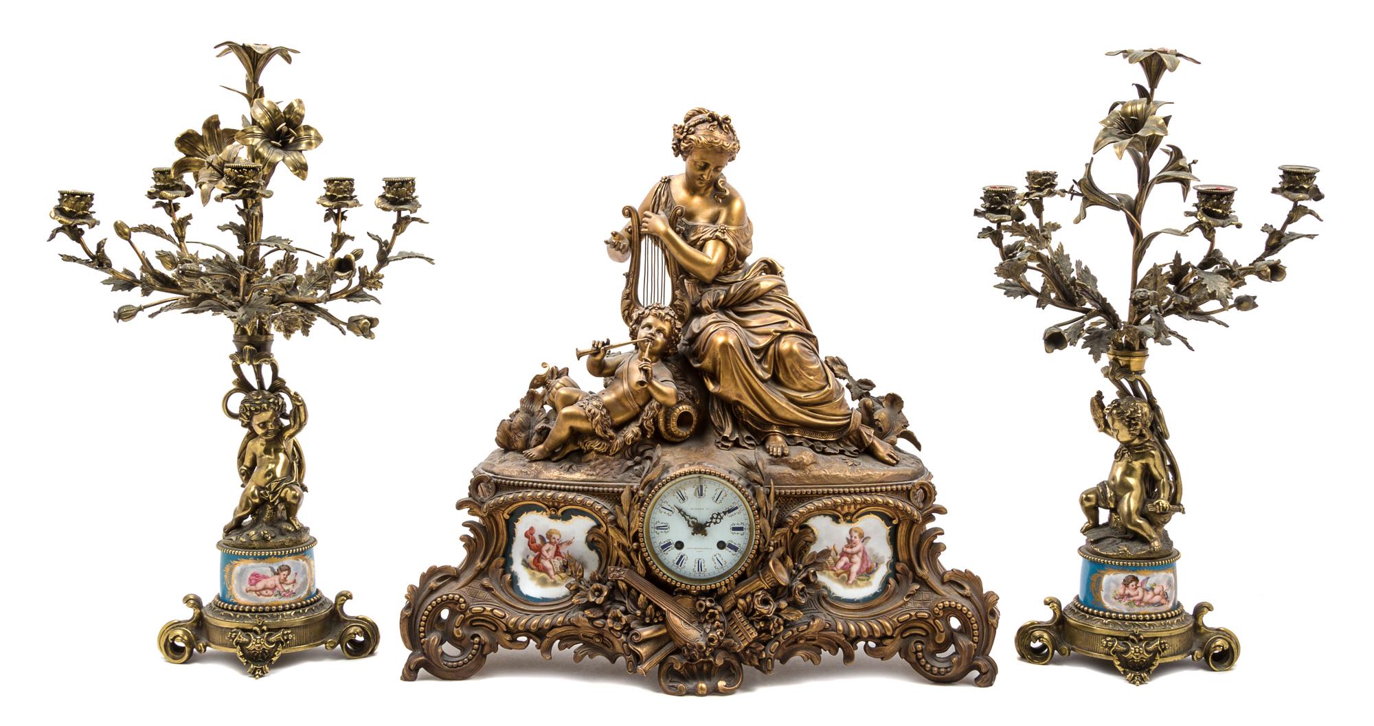A Louis XV Style Gilt Metal and Sevres Style Porcelain Garniture Height of candelabra 26 1/2 inches. — 19TH CENTURY