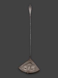 A Forged and Hammered Iron Figural Chestnut Roaster