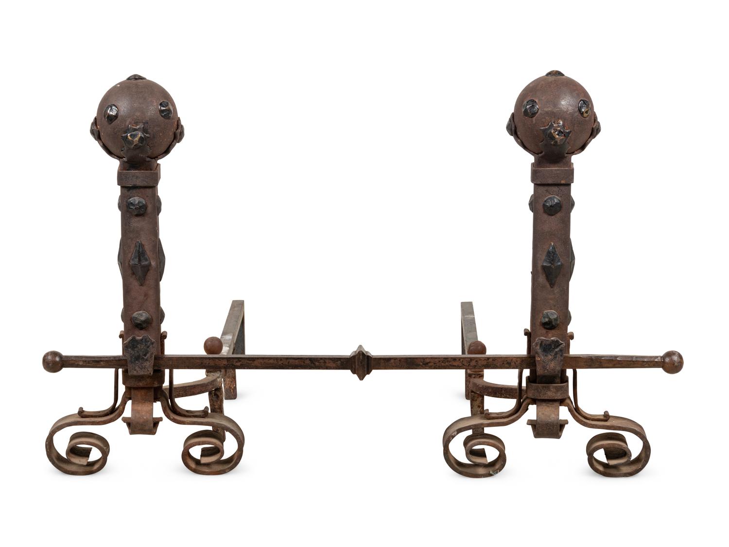 A Pair of Continental Gothic Style Iron Andirons