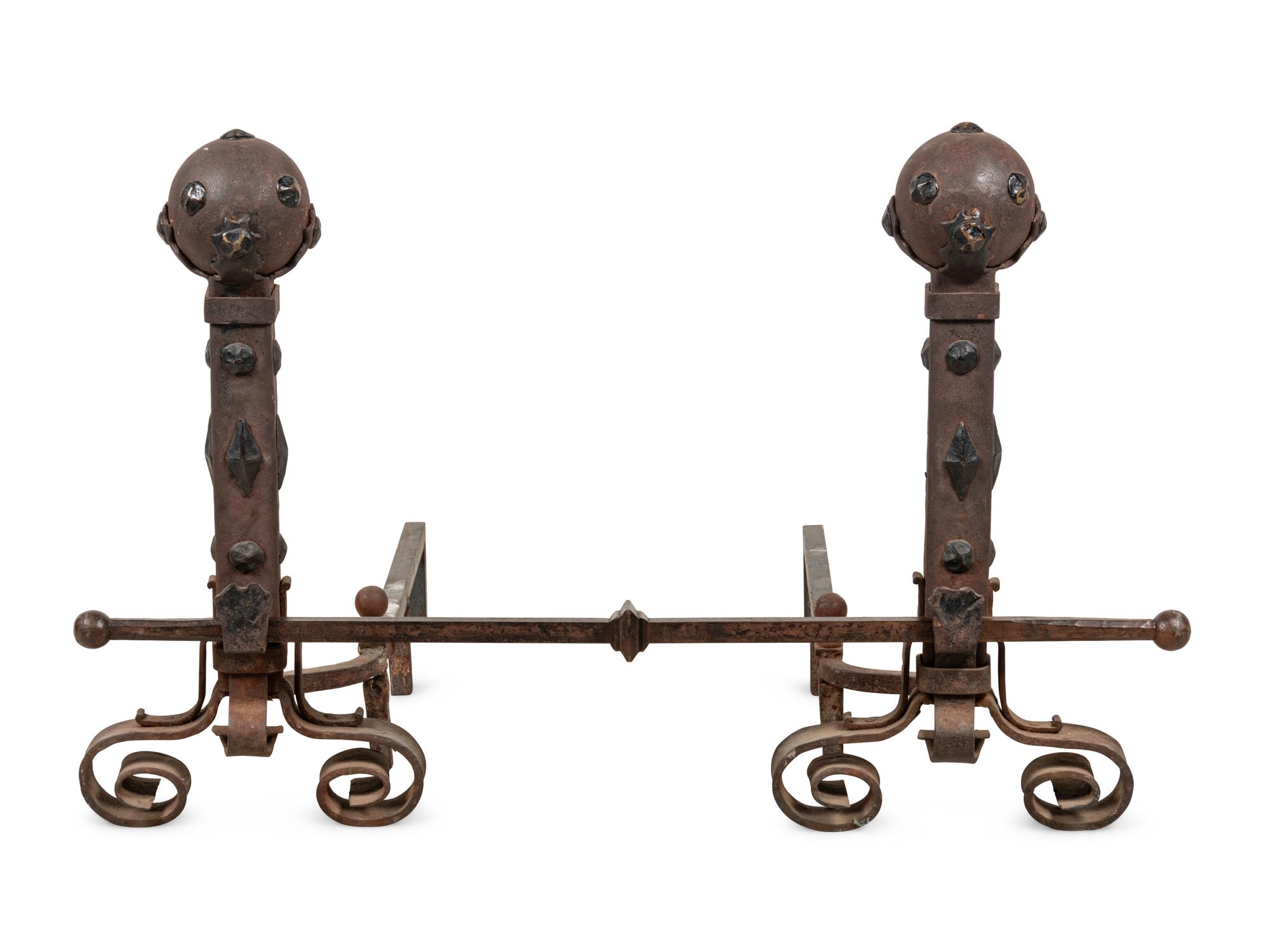 A Pair of Continental Gothic Style Iron Andirons