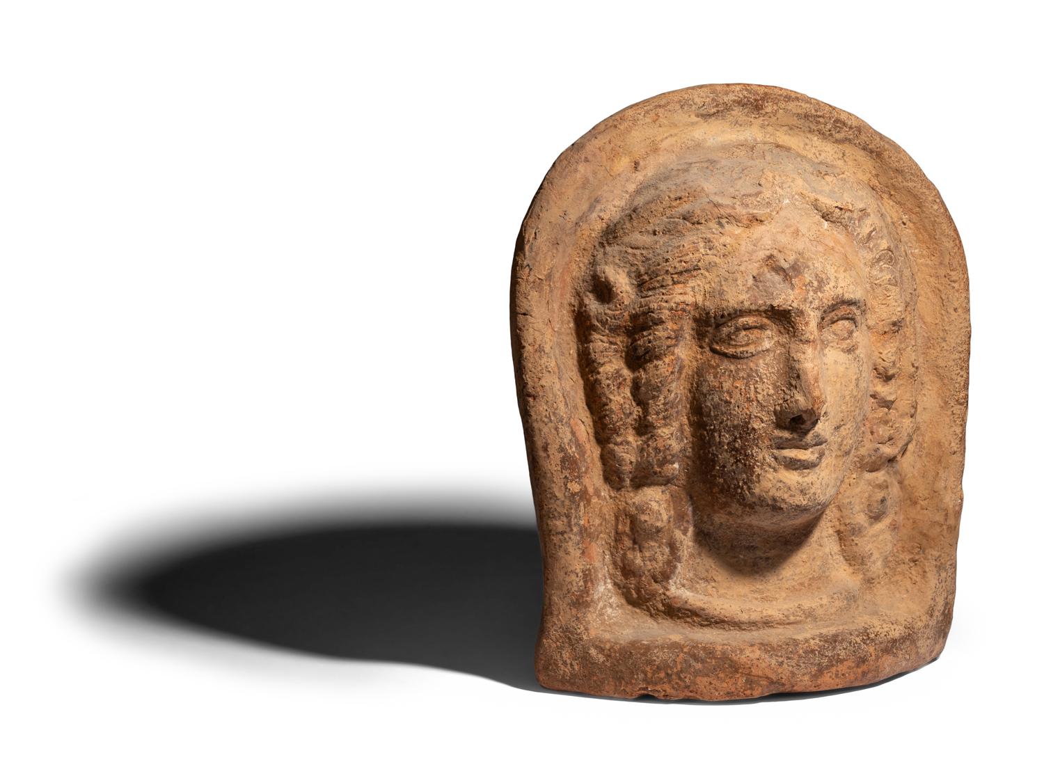An Etruscan Terracotta Votive Head of a Woman