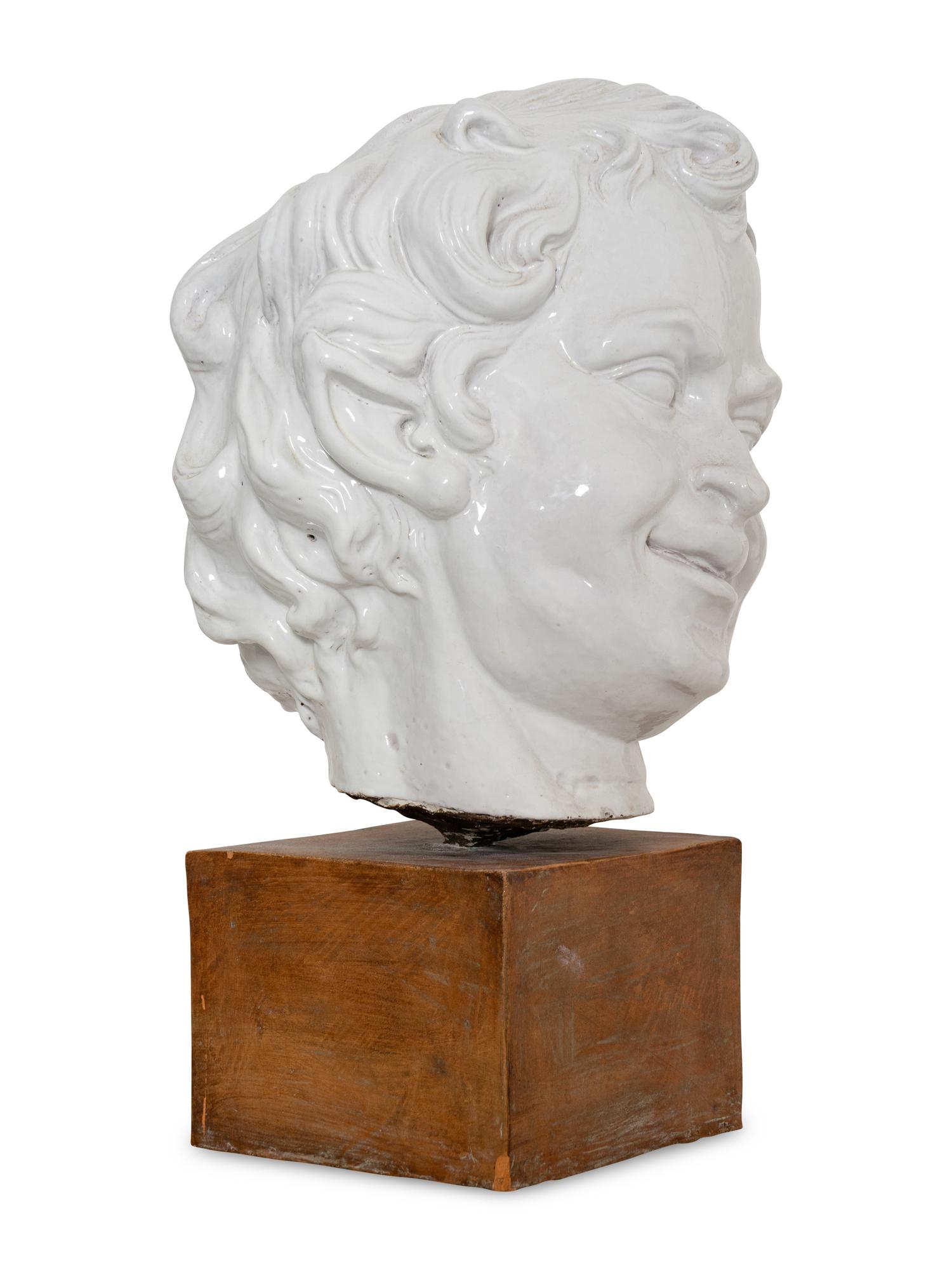 A Large White-Glazed Terracotta Bust on Ceramic Stand