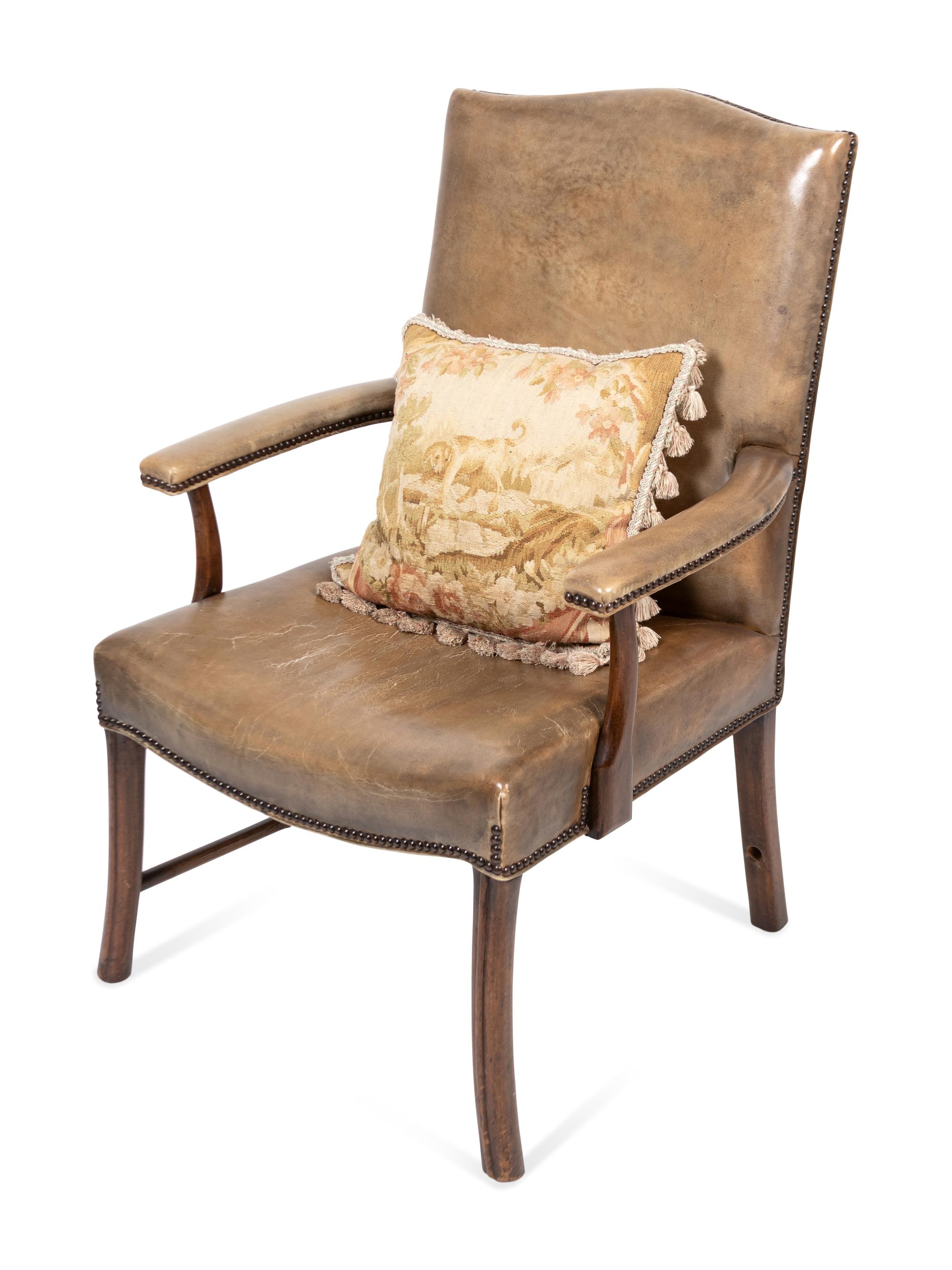 An Edwardian Mahogany Leather Upholstered Library Chair with Needlepoint Pillow