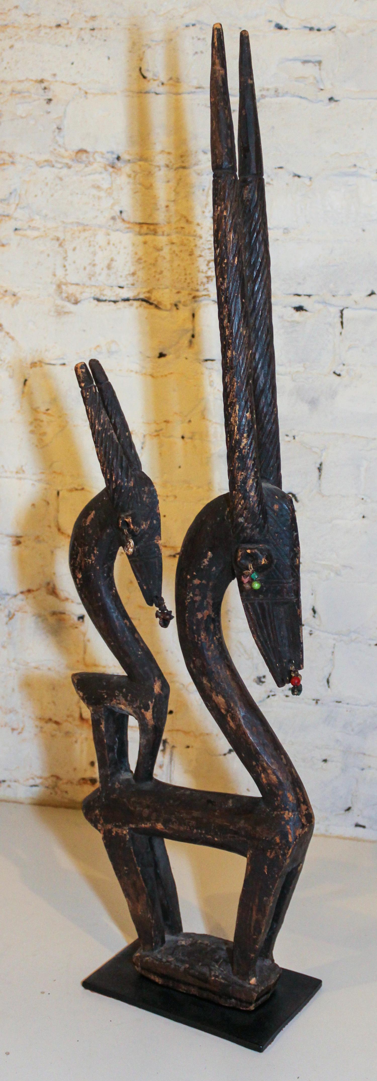 A Bambara Wood Antelope Headdress. Height 32 1/4 inches.