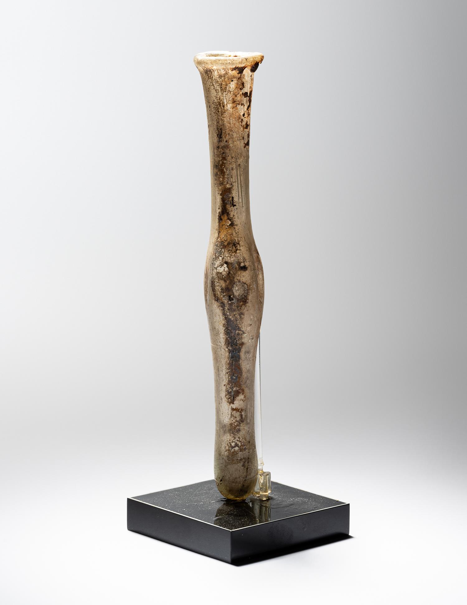A Roman Pale Yellow Glass Unguentarium