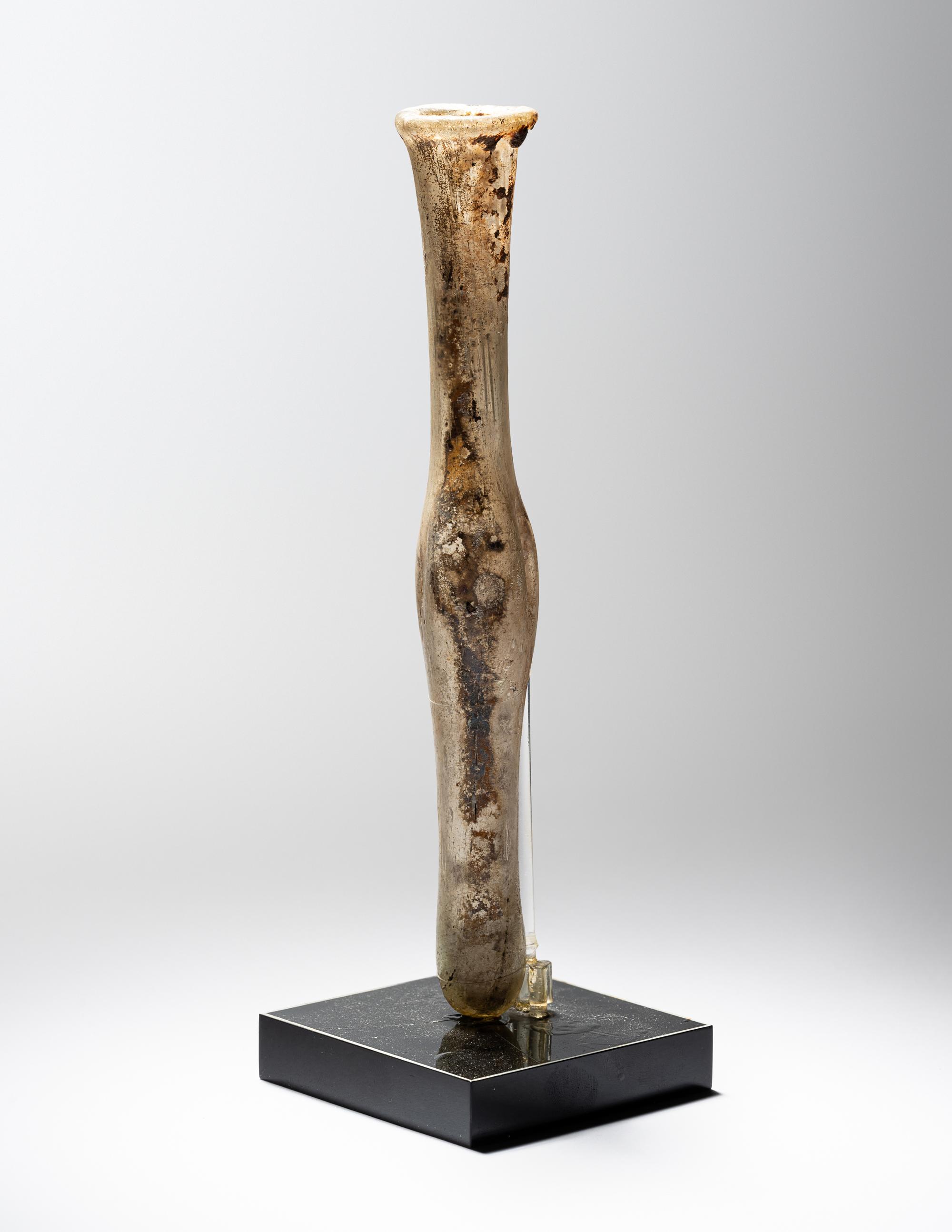 A Roman Pale Yellow Glass Unguentarium