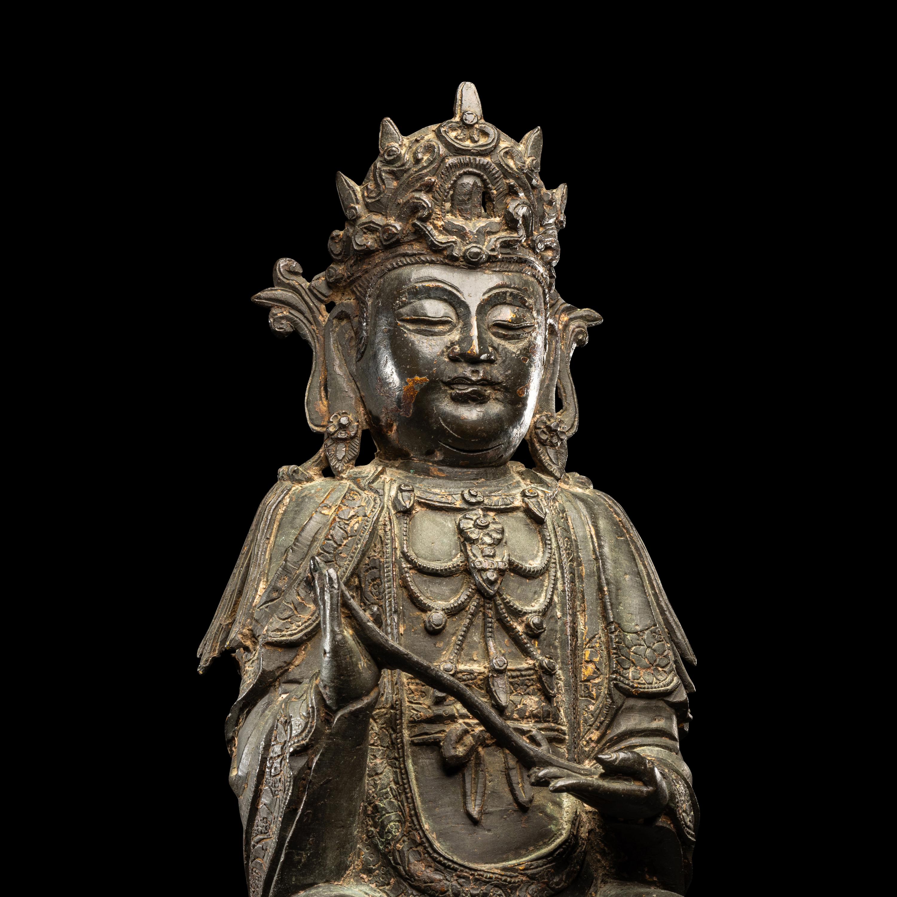 A Chinese Parcel-Gilt Bronze Figure of Guanyin, Ming Dynasty 明 銅局部鎏金觀音坐像