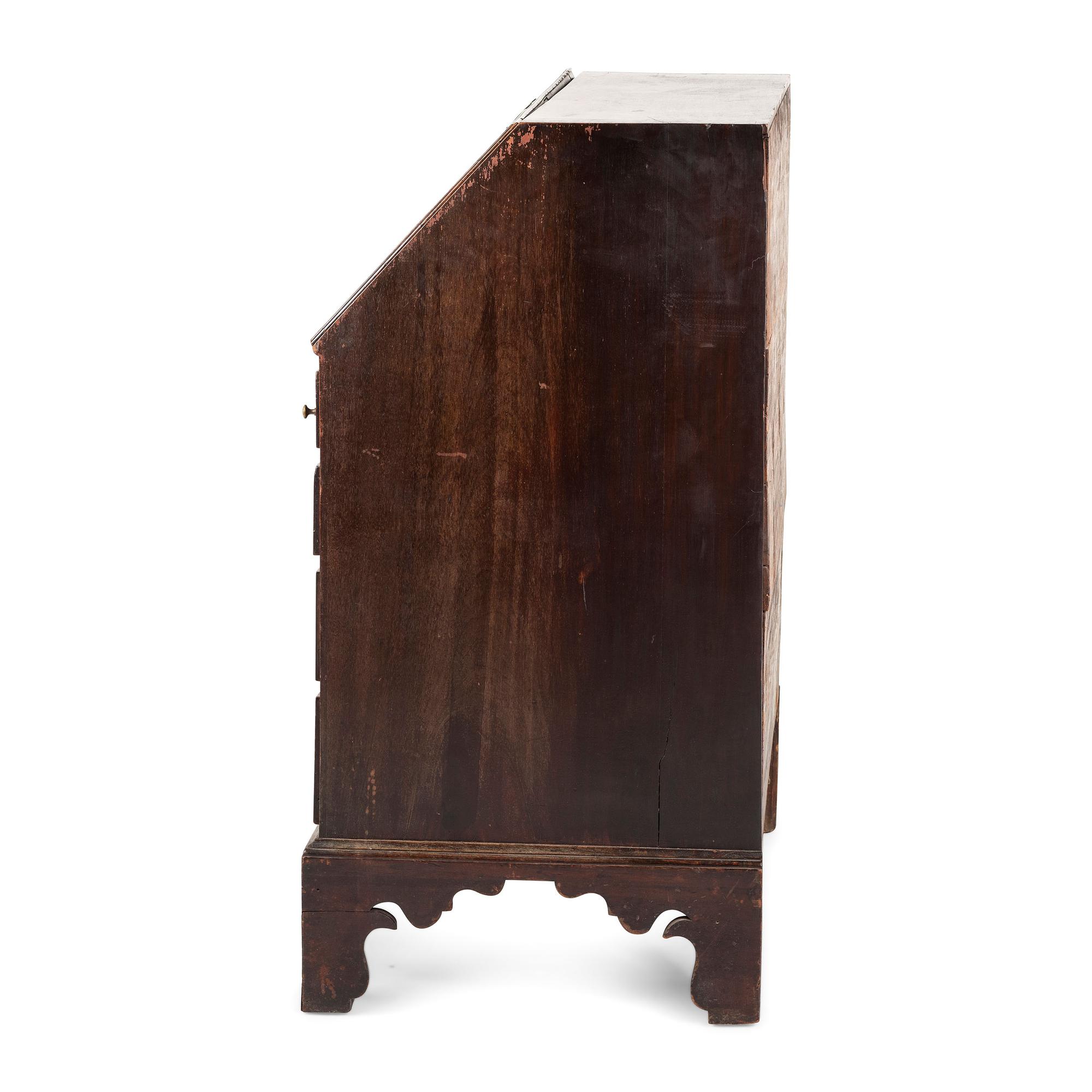 A Chippendale Carved and Figured Mahogany Slant-Front Desk