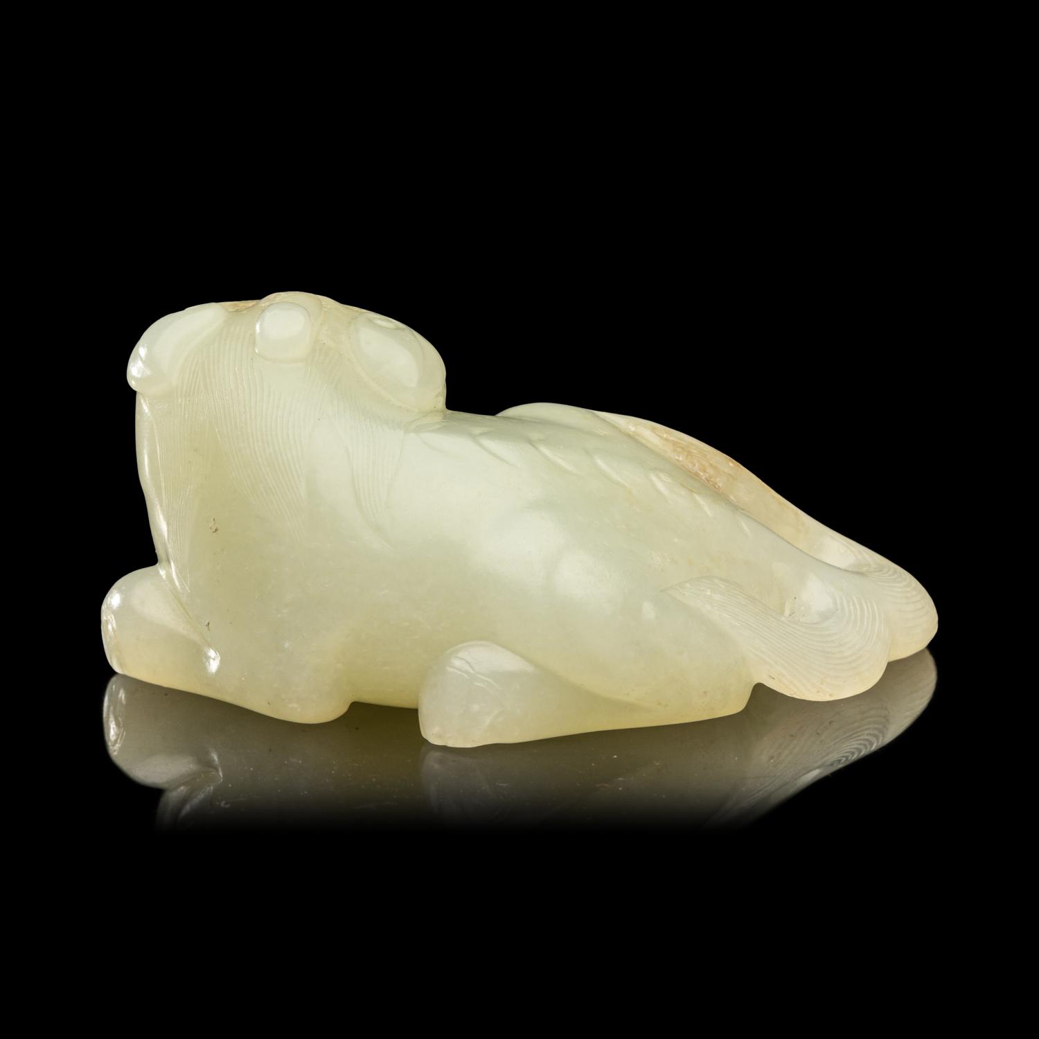 A Chinese Pale Celadon Jade Figure of a Mythical Beast, Early Qing Dynasty 清早期 青白玉瑞獸