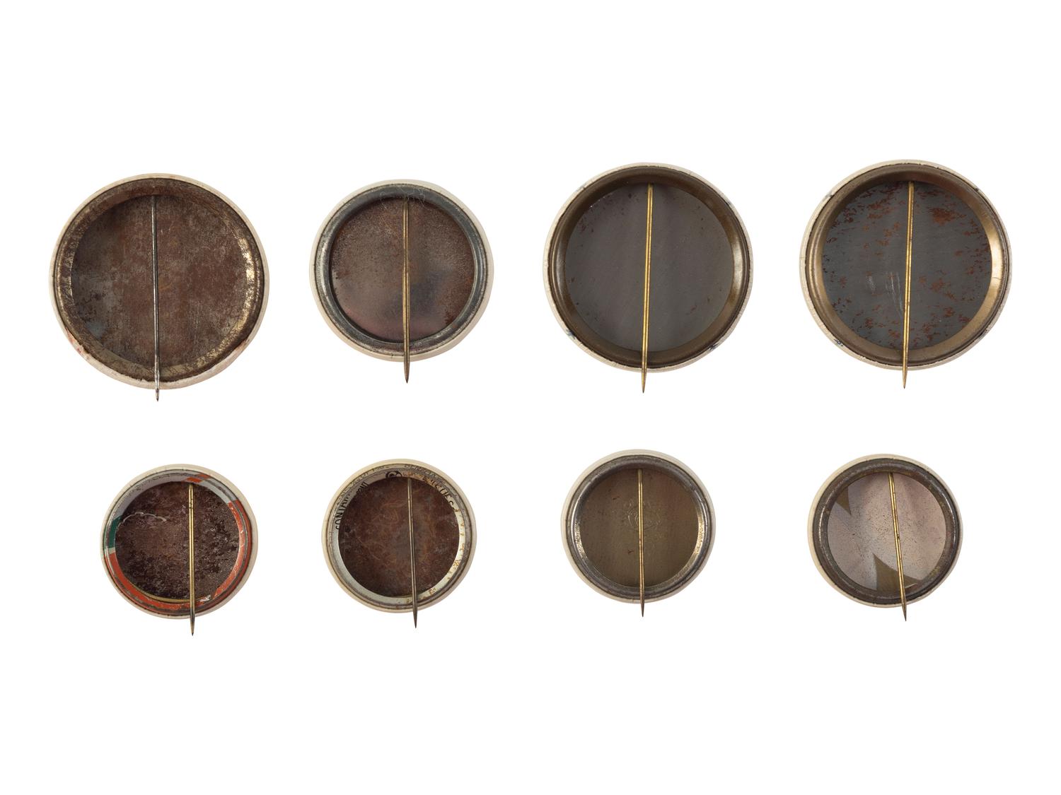 [BASEBALL]. A group of 8 pinback buttons promoting Negro League baseball teams. Ca 1930s-1940s.