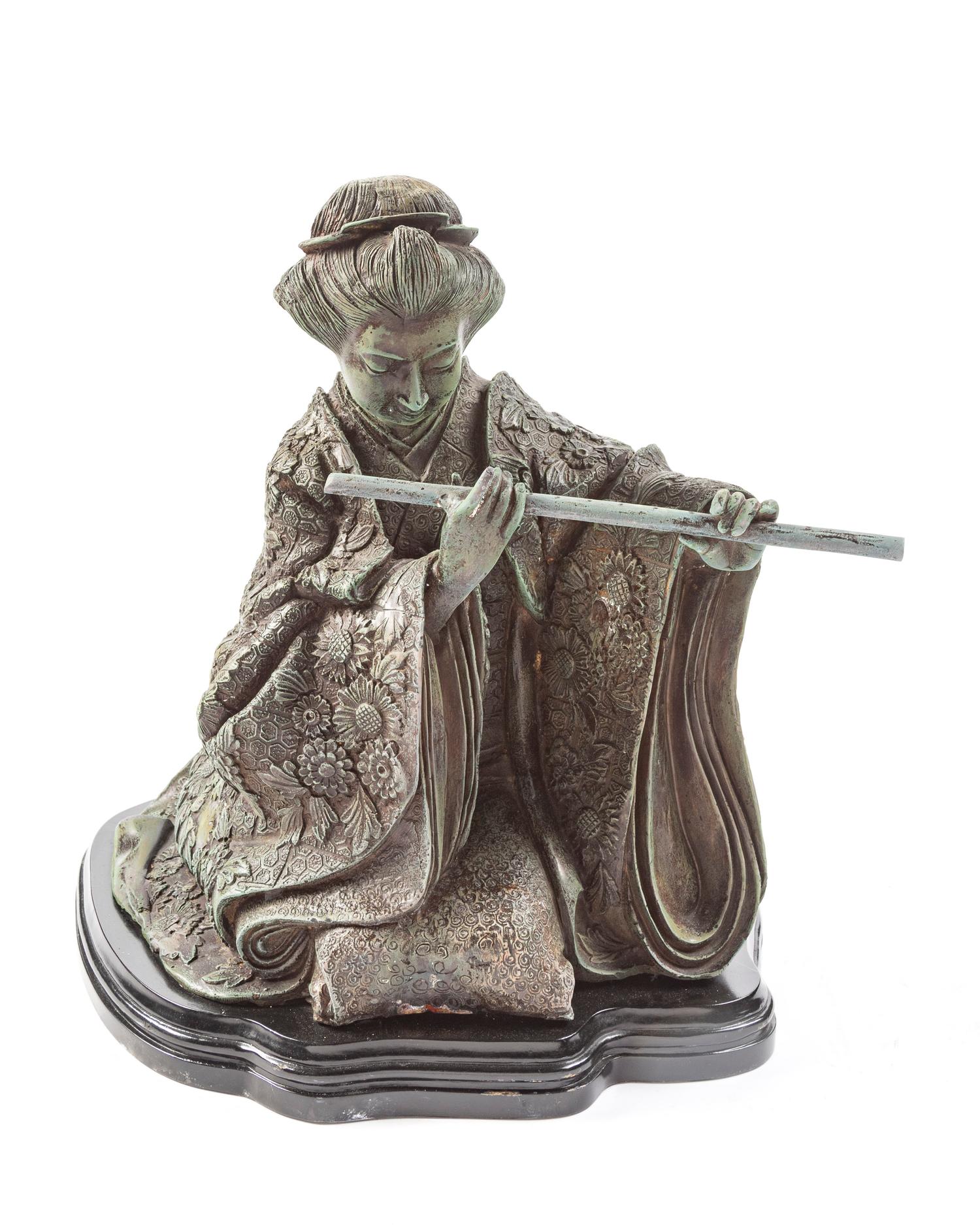A Japanese Bronze Figure of a Woman Playing the Flute