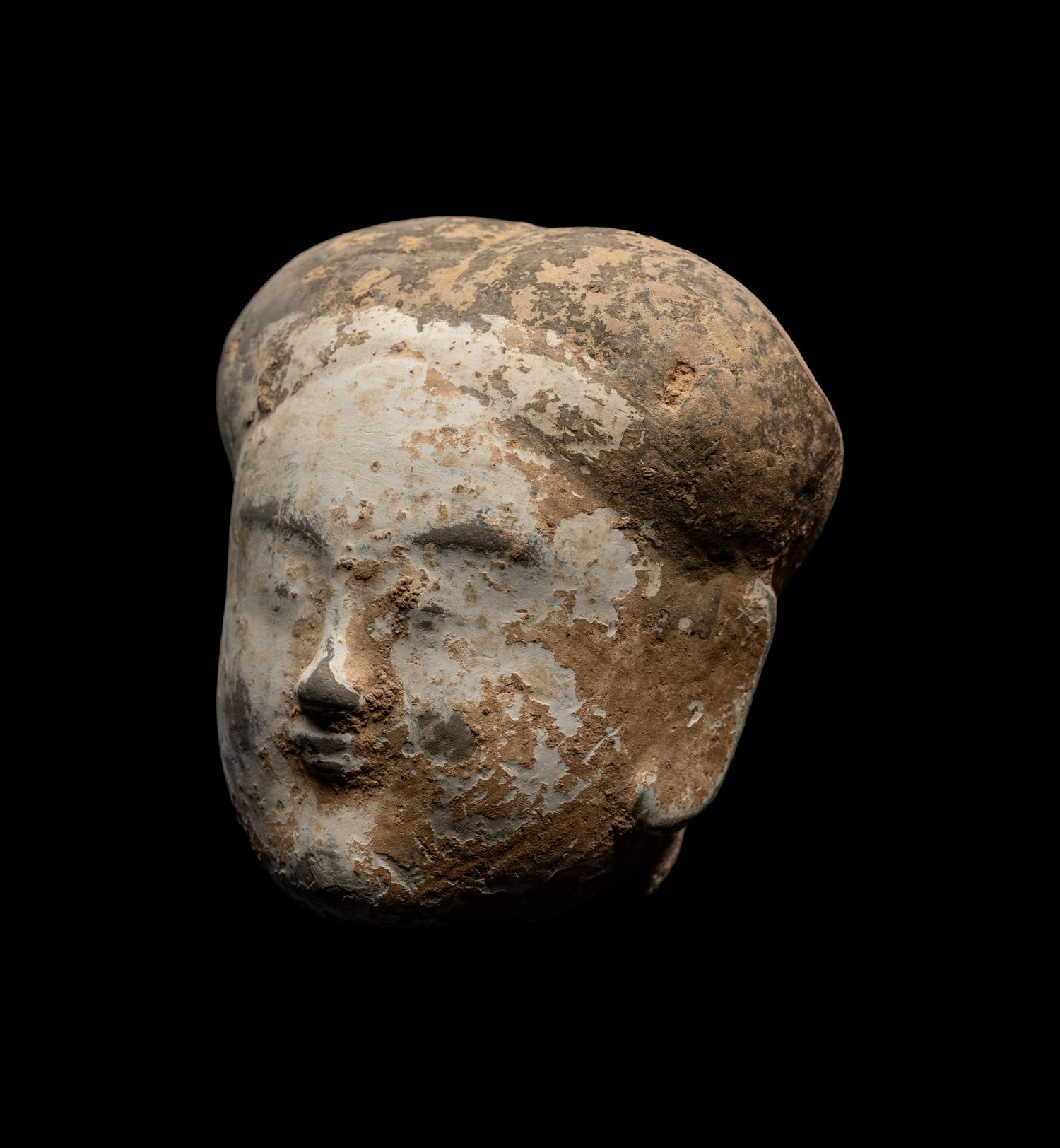 A Chinese Pottery Head of an Attendant
