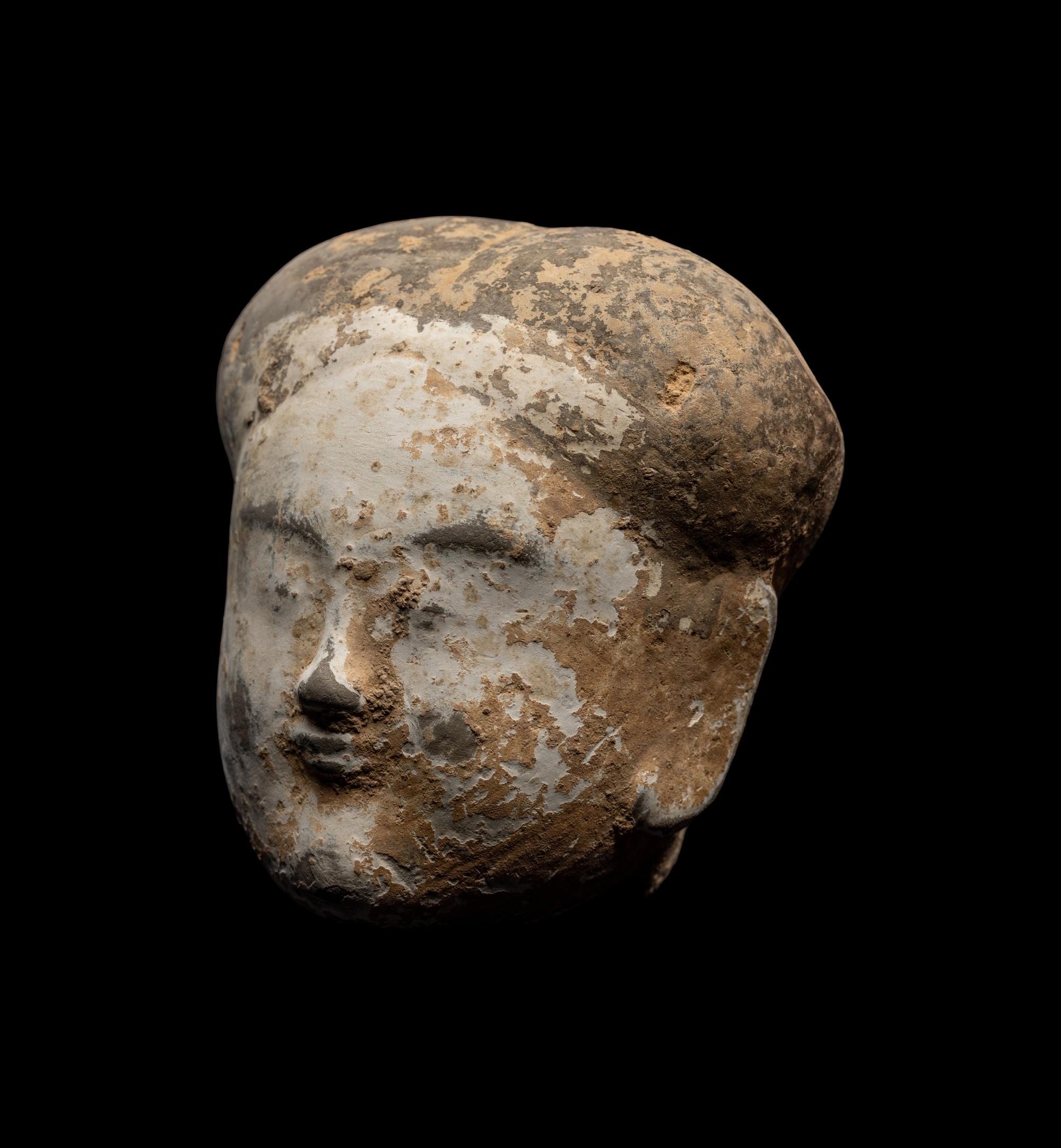 A Chinese Pottery Head of an Attendant
