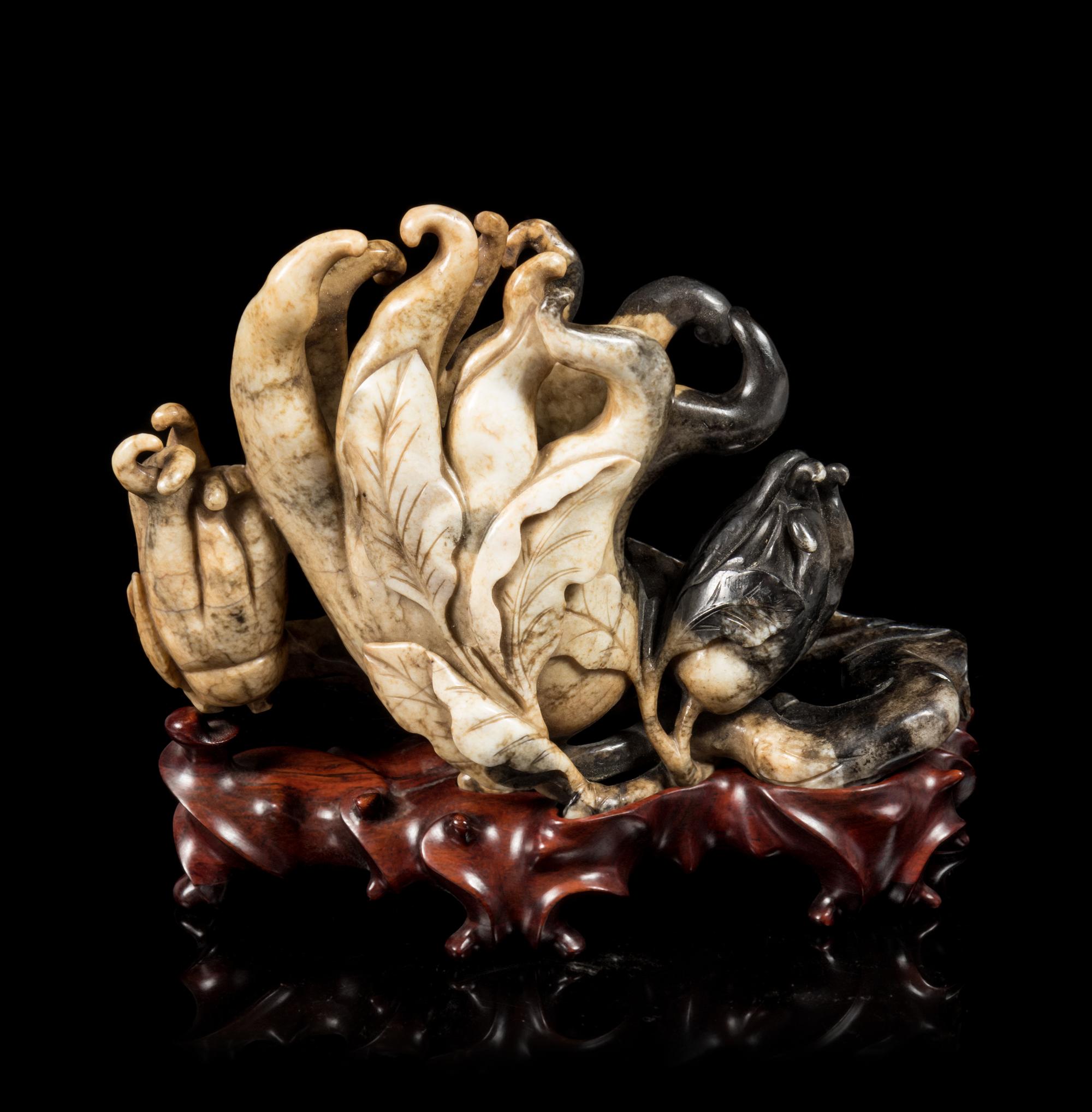 A Chicken Bone and Black Jade Carving of a Buddha's Hand Cirtrons Length 9 inches. — 18TH CENTURY