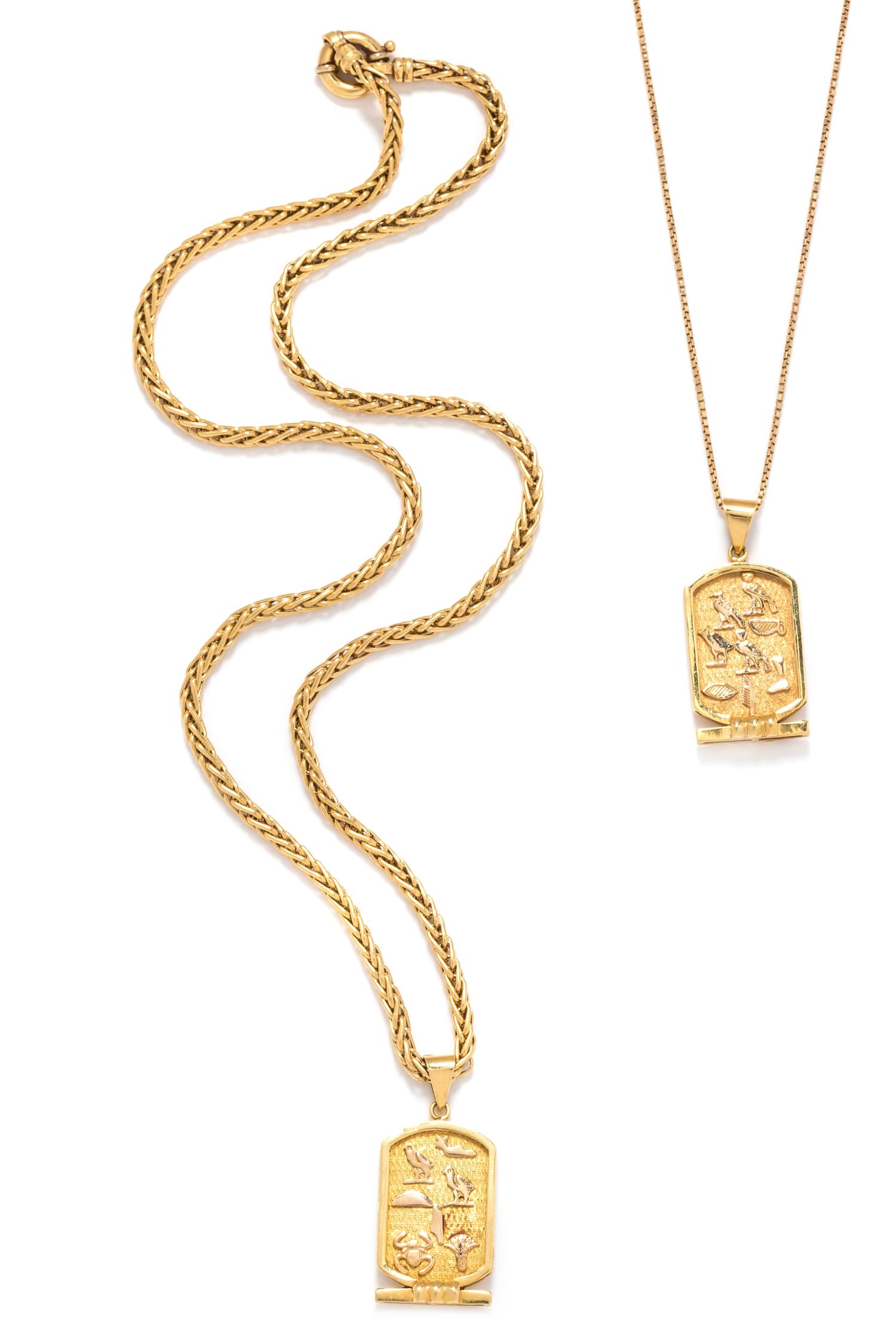 A Collection of Yellow Gold Egyptian Motif Pendant/Necklaces,