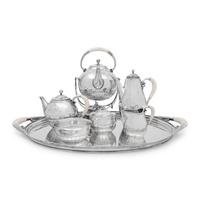 A Georg Jensen Cosmos Seven-Piece Silver Tea and Coffee Service