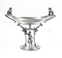 An Aesthetic Movement Silver-Plate Centerpiece Bowl Height 14 1/2 inches.
