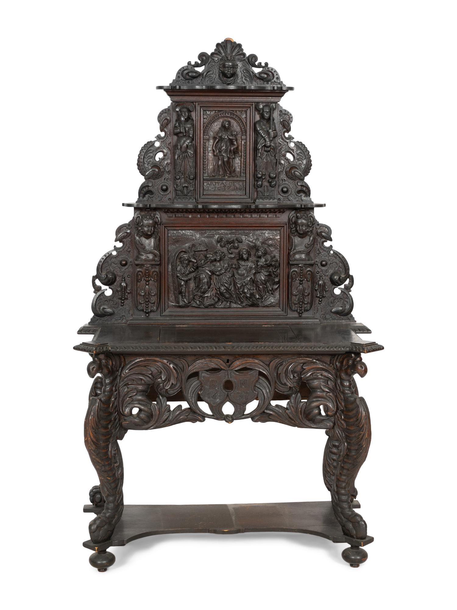 A Renaissance Revival Elaborately Carved Oak Stand