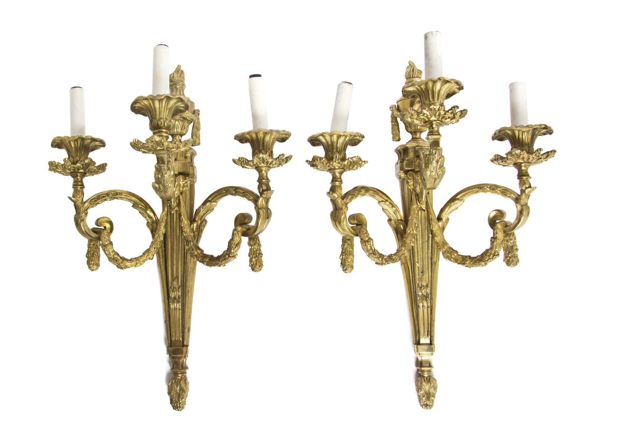 A Pair of Louis XVI Style Gilt Bronze Three-Light Sconces, Height 20 1/2 inches.