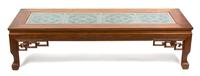 A Chinese Carved Teak Coffee Table Height 16 x width 63 3/4 x depth 23 1/2 inches. — 20TH CENTURY