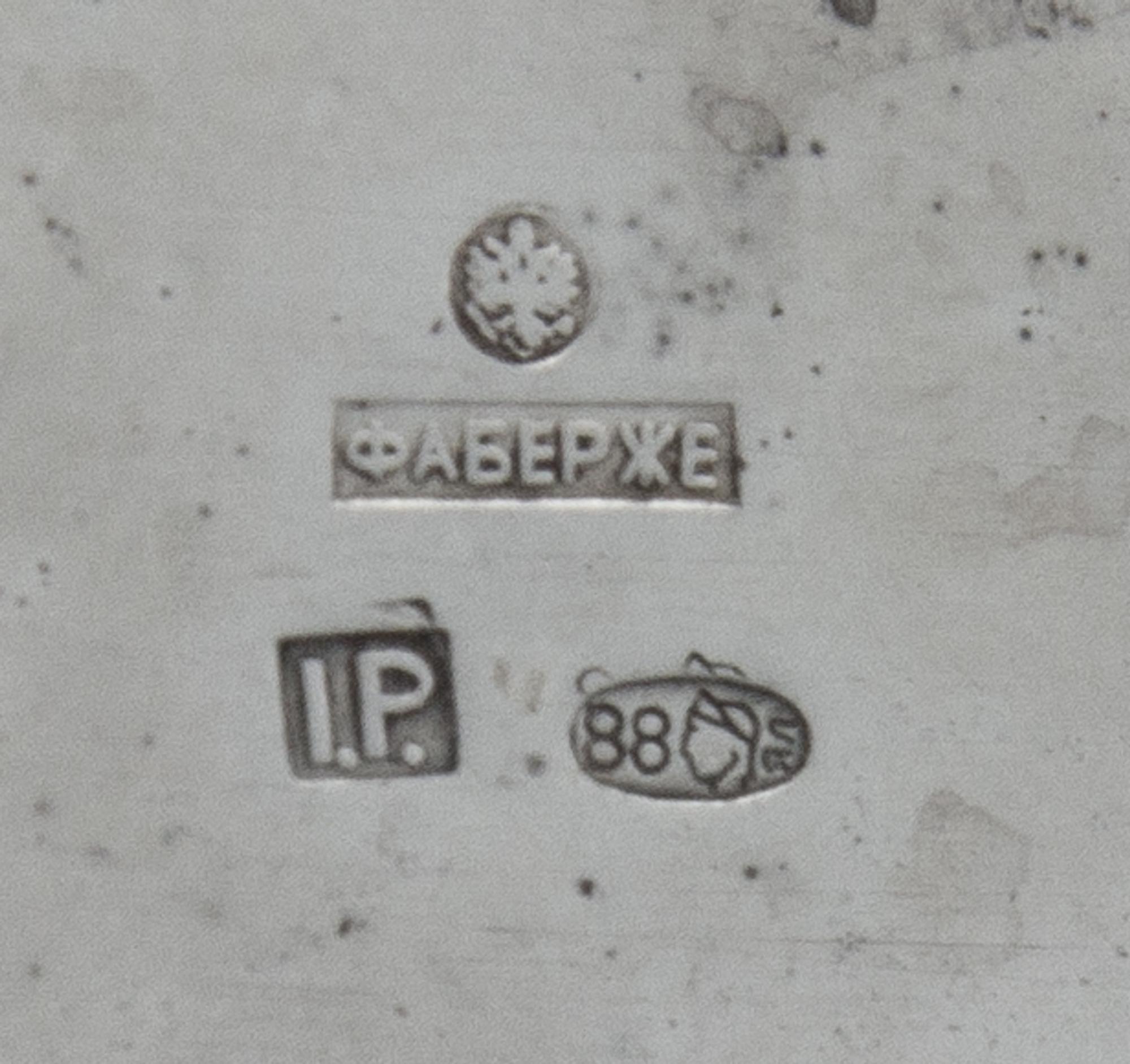 A Russian Enameled Silver Kovsh, Spurious Faberge Mark Overstriking Maker's Mark, Late 19th/Early 20th Century, the body inset with a g