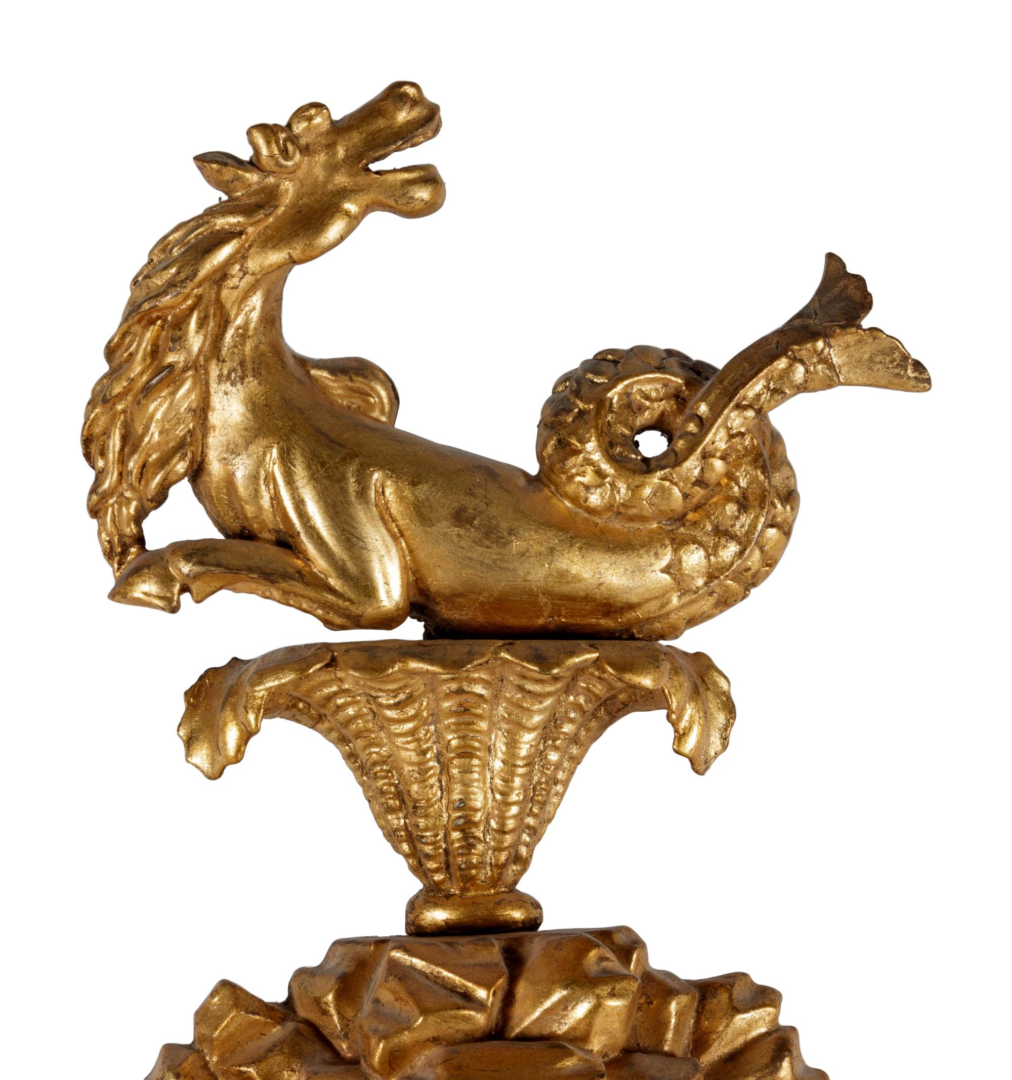 A George III Carved Giltwood Sea Dragon Bull's Eye Mirror