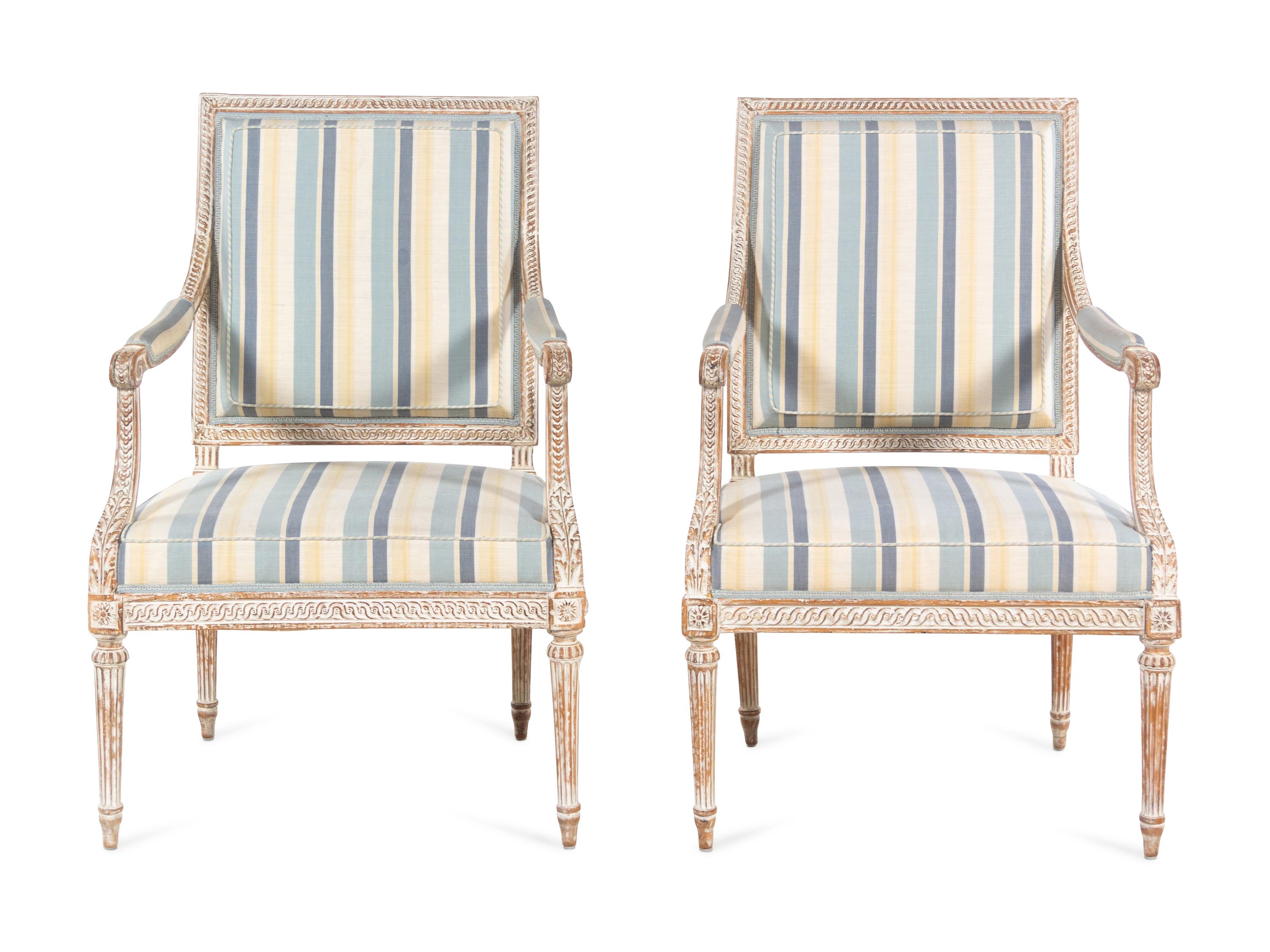 A Pair of Louis XVI Style Cream-Painted Fauteuils