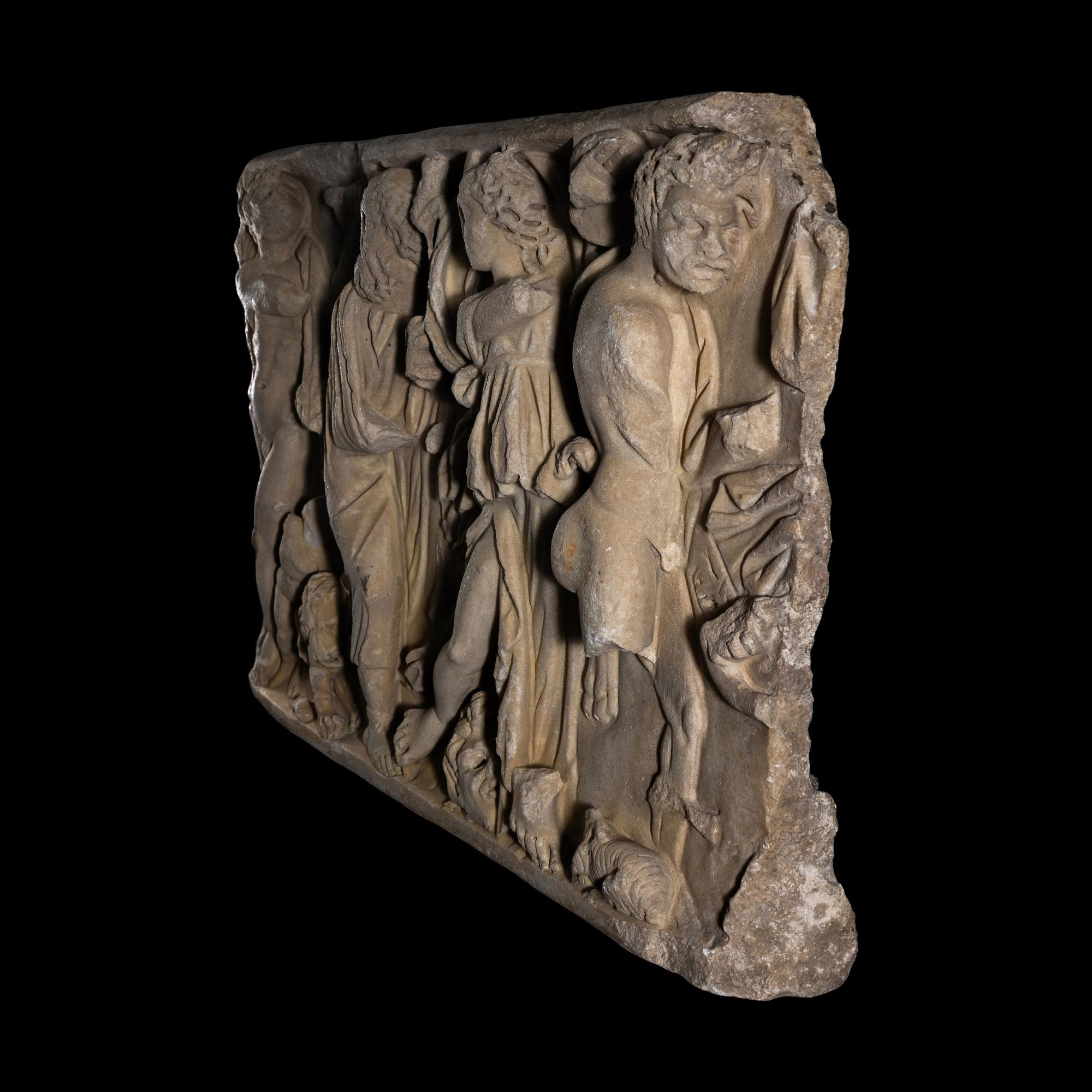 A Roman Marble Sarcophagus Fragment with a Dionysian Scene