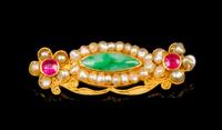 A Jadeite, 24 Karat Gold and Pearl Brooch Width 2 inches.