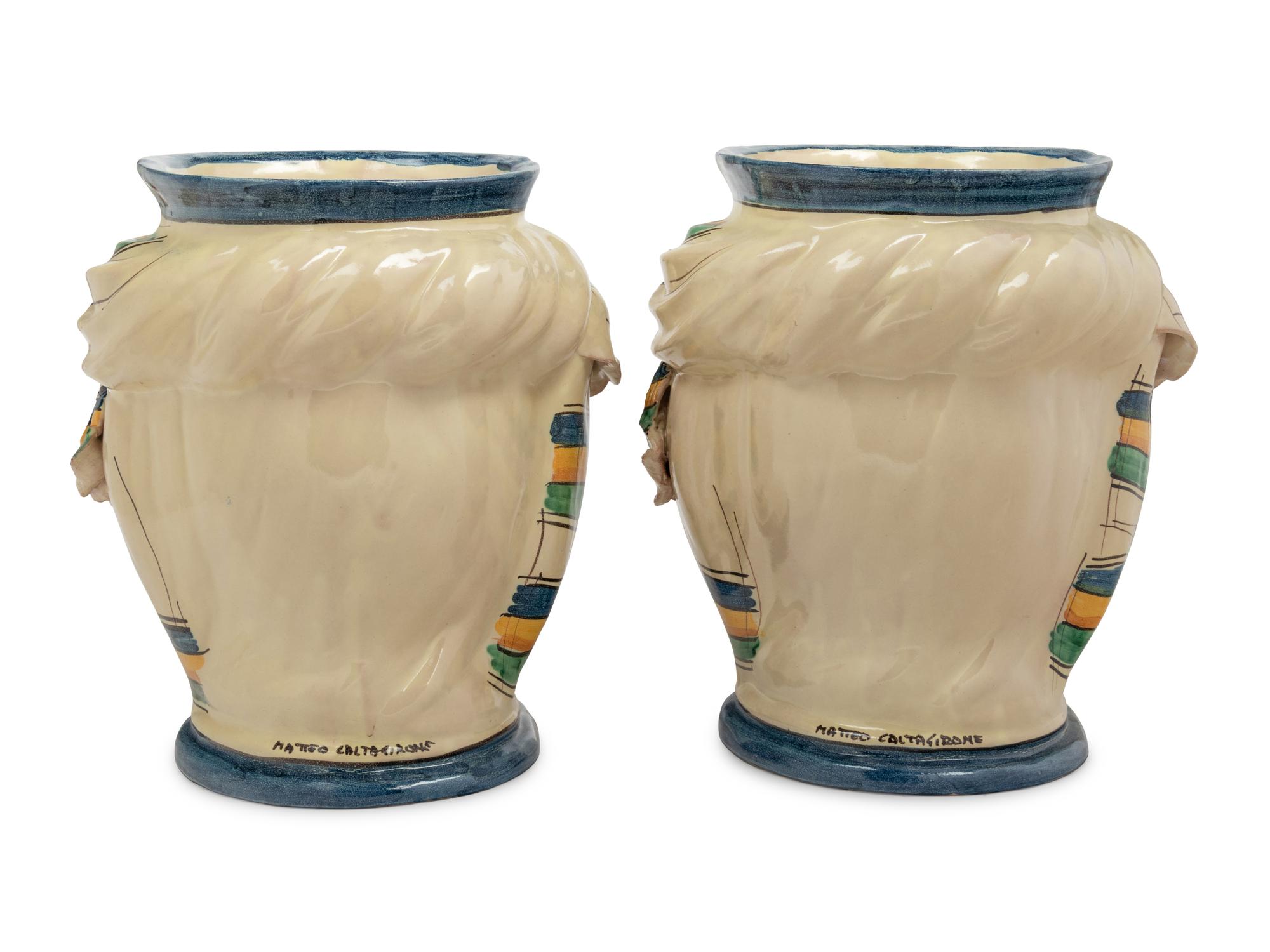 A Pair of Italian Polychrome Glazed Pottery Figural Vases