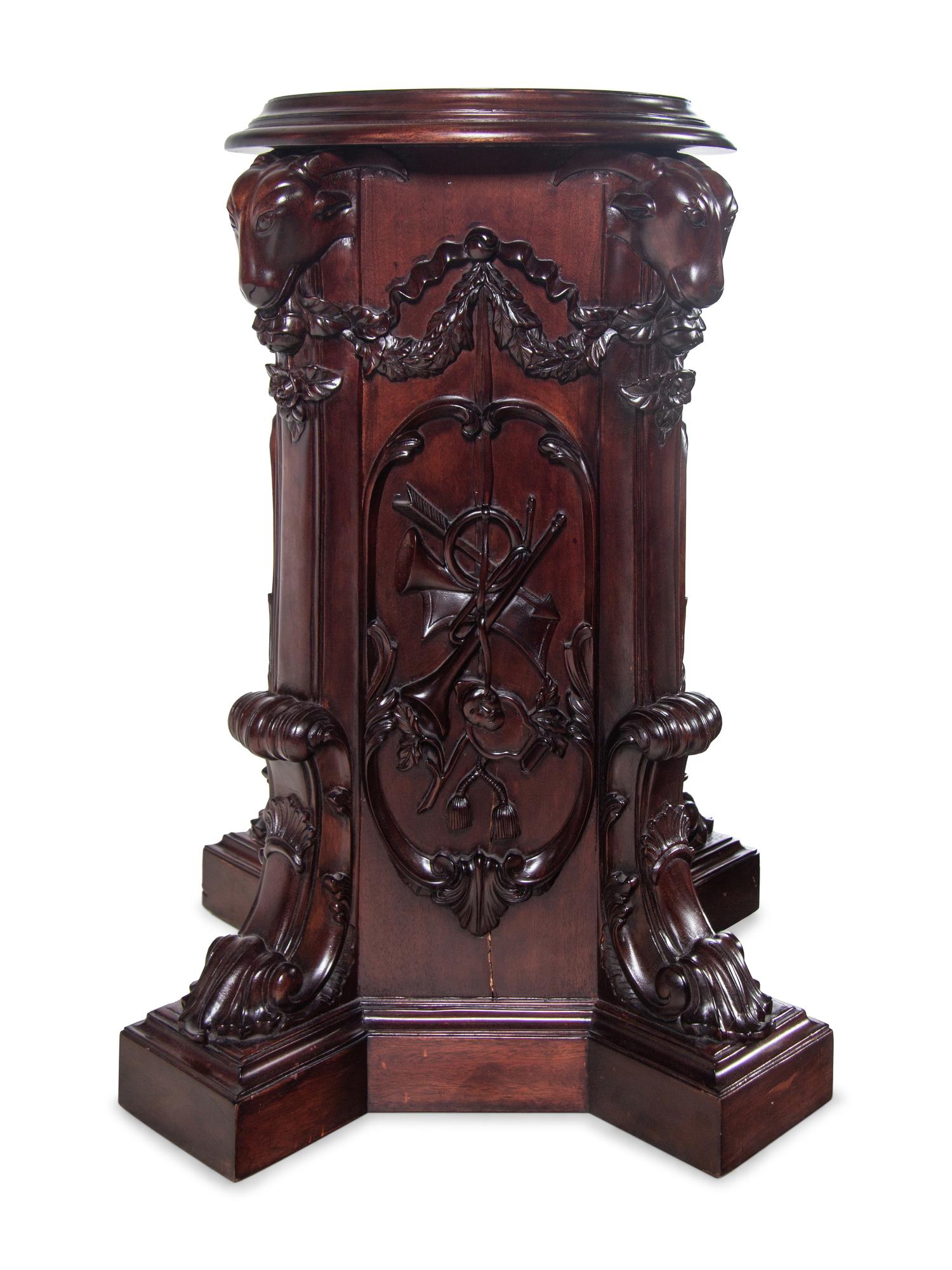 A Pair of George III Style Carved Mahogany Pedestals