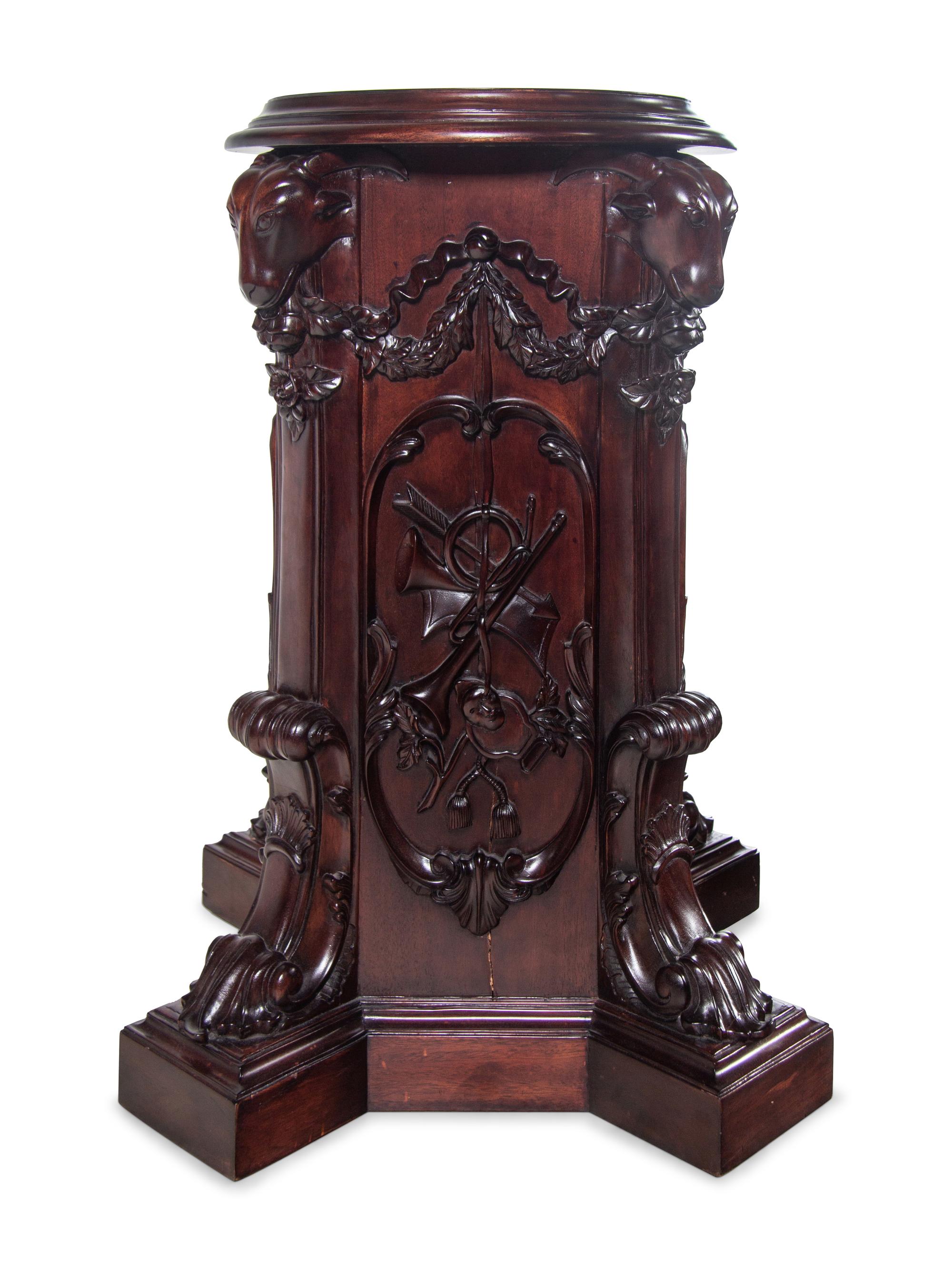 A Pair of George III Style Carved Mahogany Pedestals