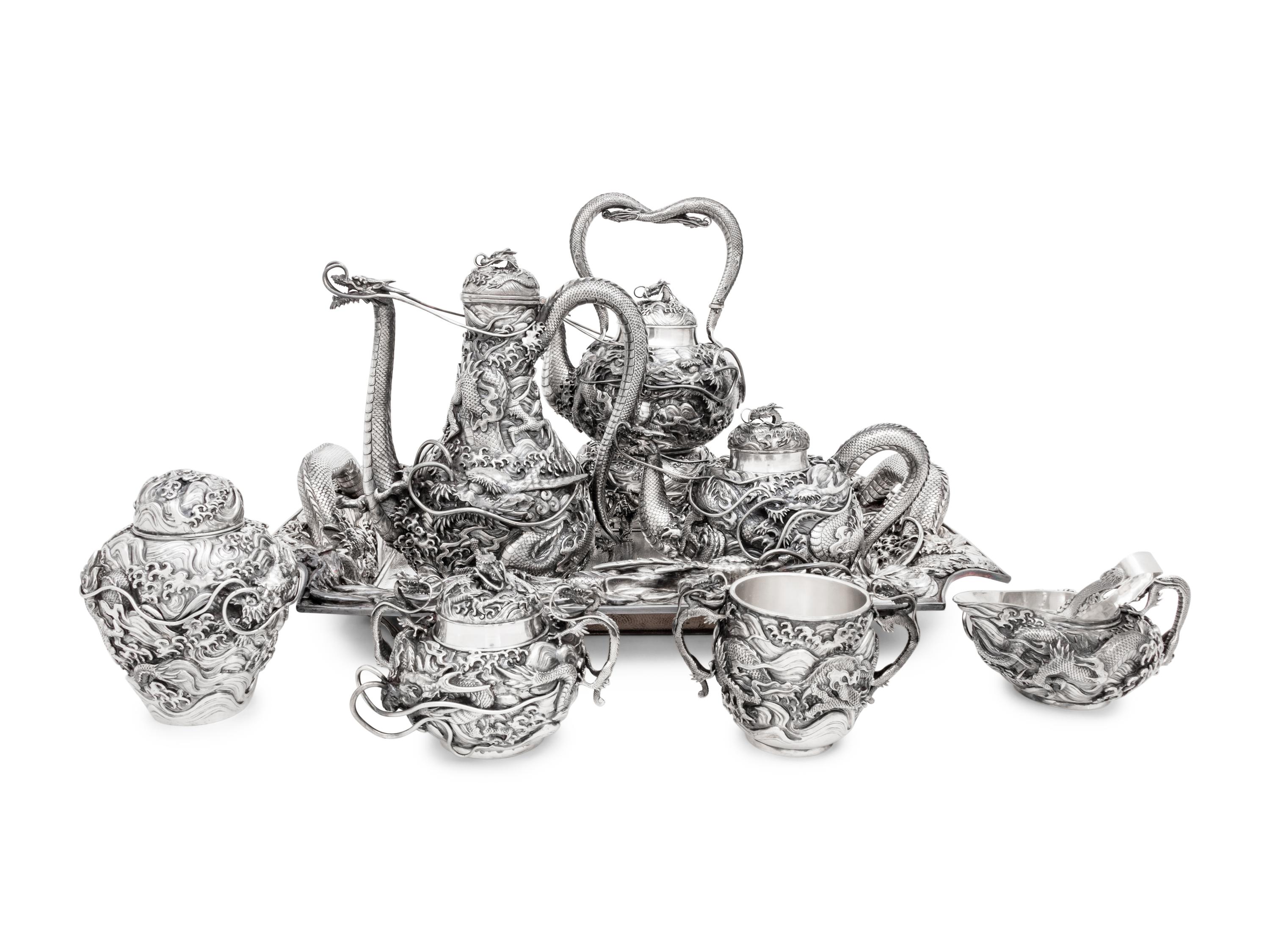 An Ornate Japanese Export Silver Eight-Piece Tea and Coffee Service